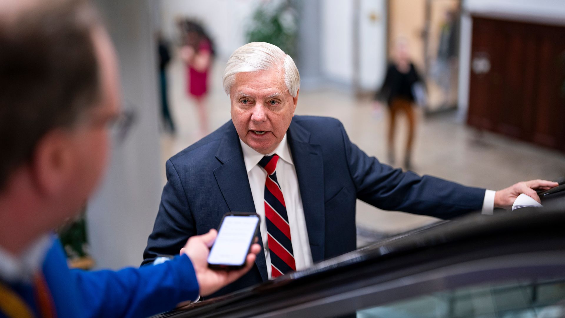 Senator Lindsey Graham, a Republican from South Carolina, speaks with members of the media while arriving in the Senate Subway during a vote at the US Capitol in Washington, DC, US, on Wednesday, Feb. 7, 2024. 