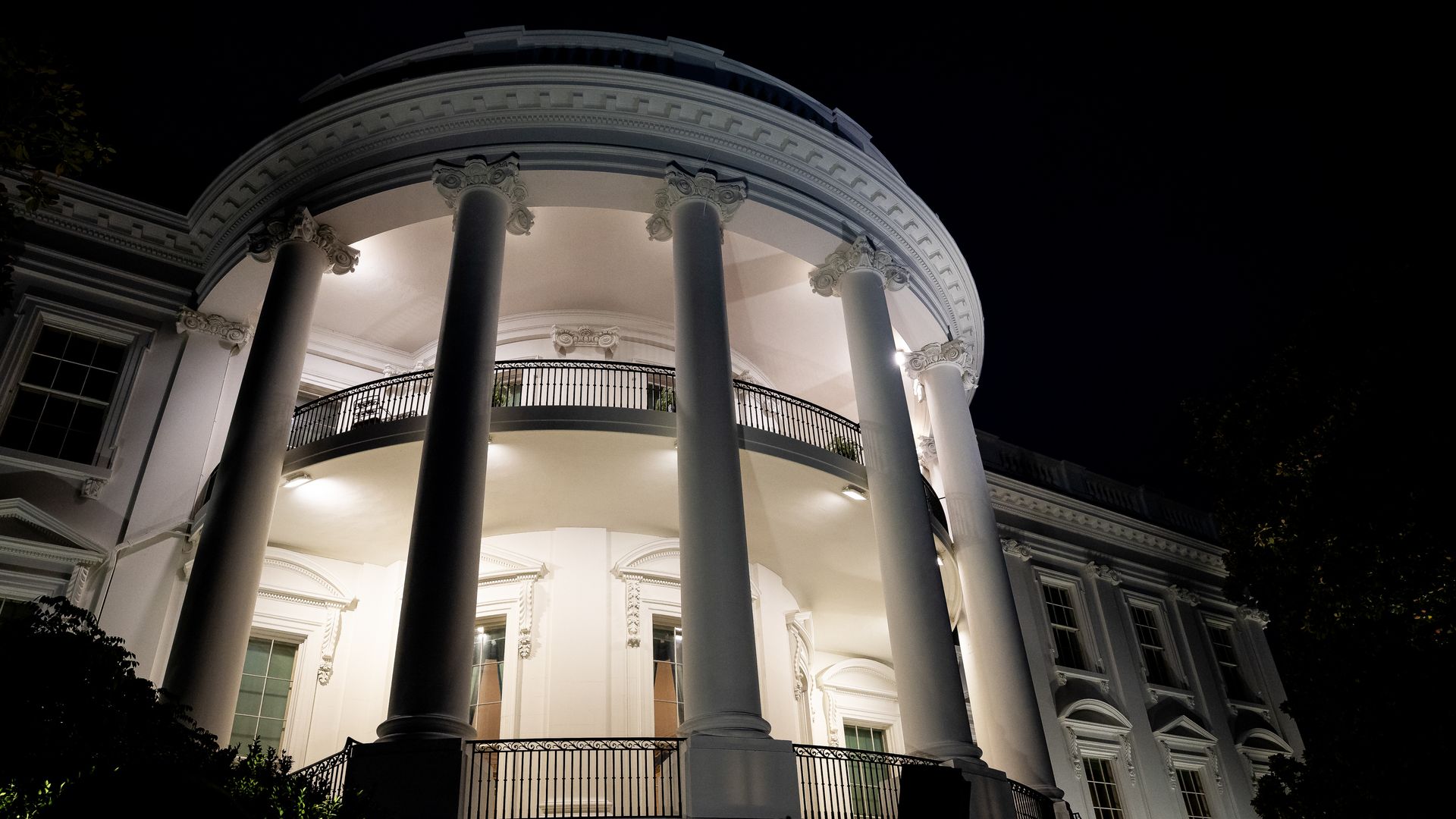 Exterior shot of the White House at night