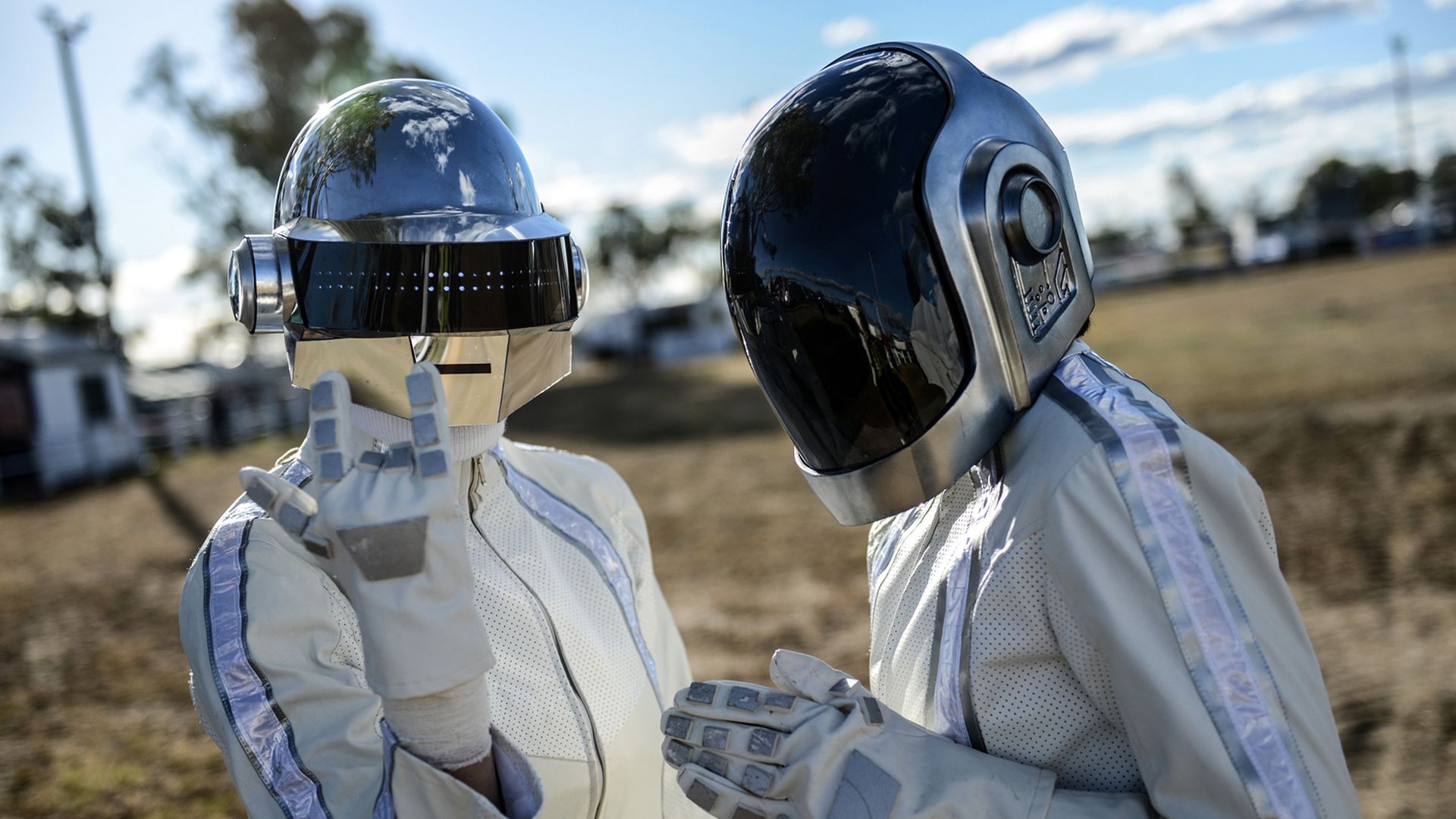 The French duo of Daft Punk poses for a photo in their robot costumes. 