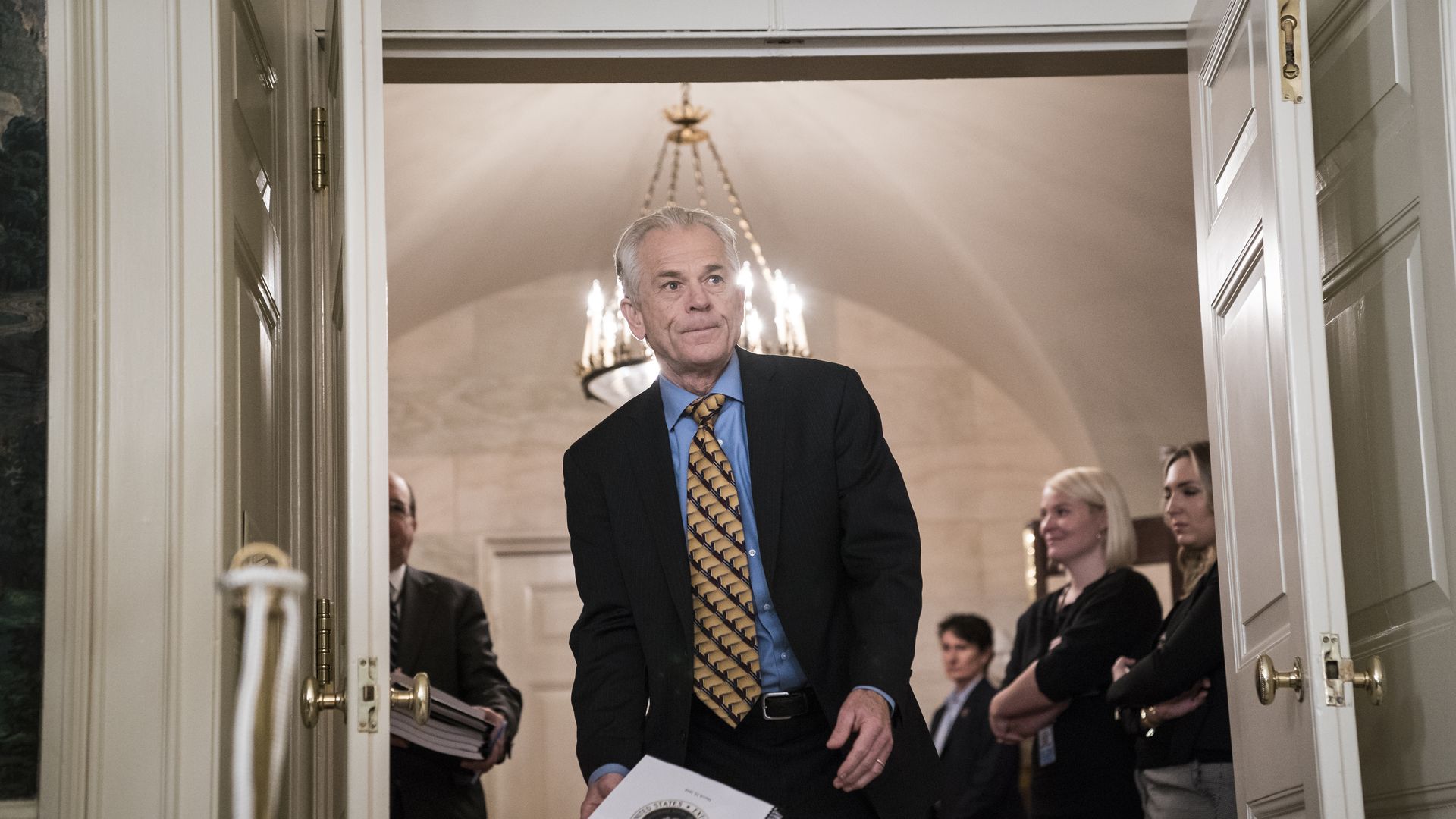 Peter Navarro, Assistant to the President, walks through a door in the White House