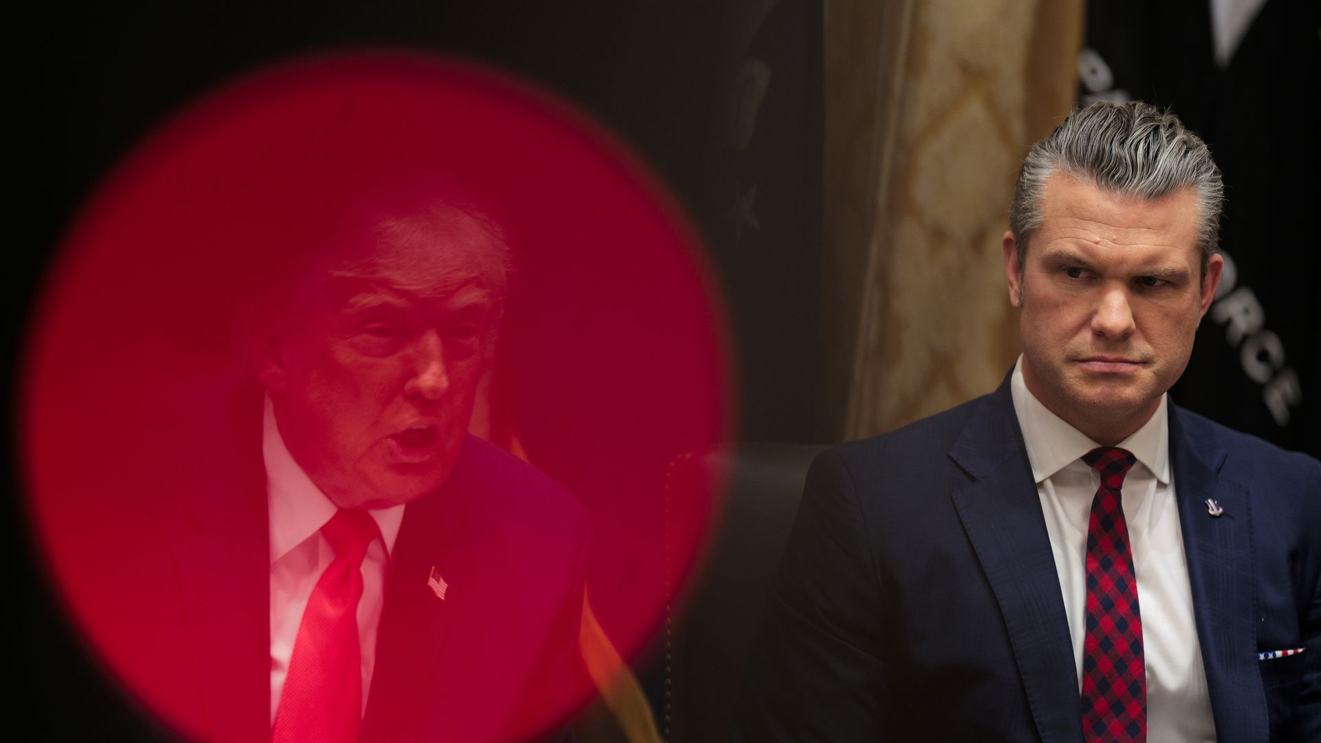 Pete Hegseth sits next to Donald Trump as the president speaks during a Cabinet meeting.