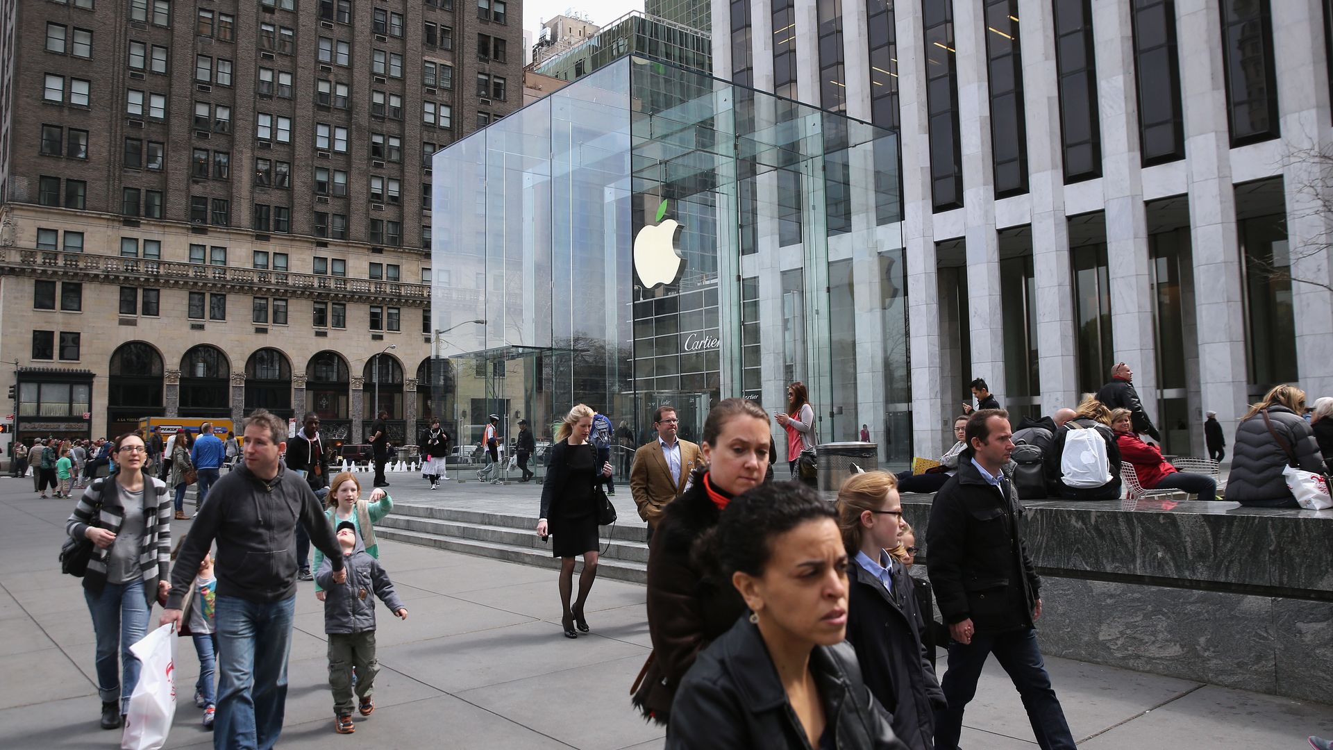 People walk past the Apple store in Manhattan