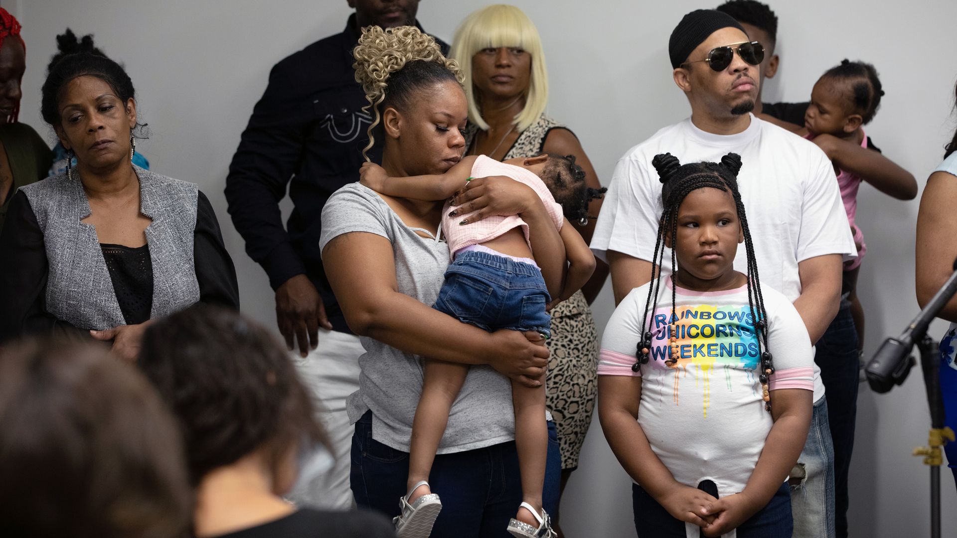  Rayshard Brooks widow Tomika Miller holds one of her daughters as family lawyers speaks to media
