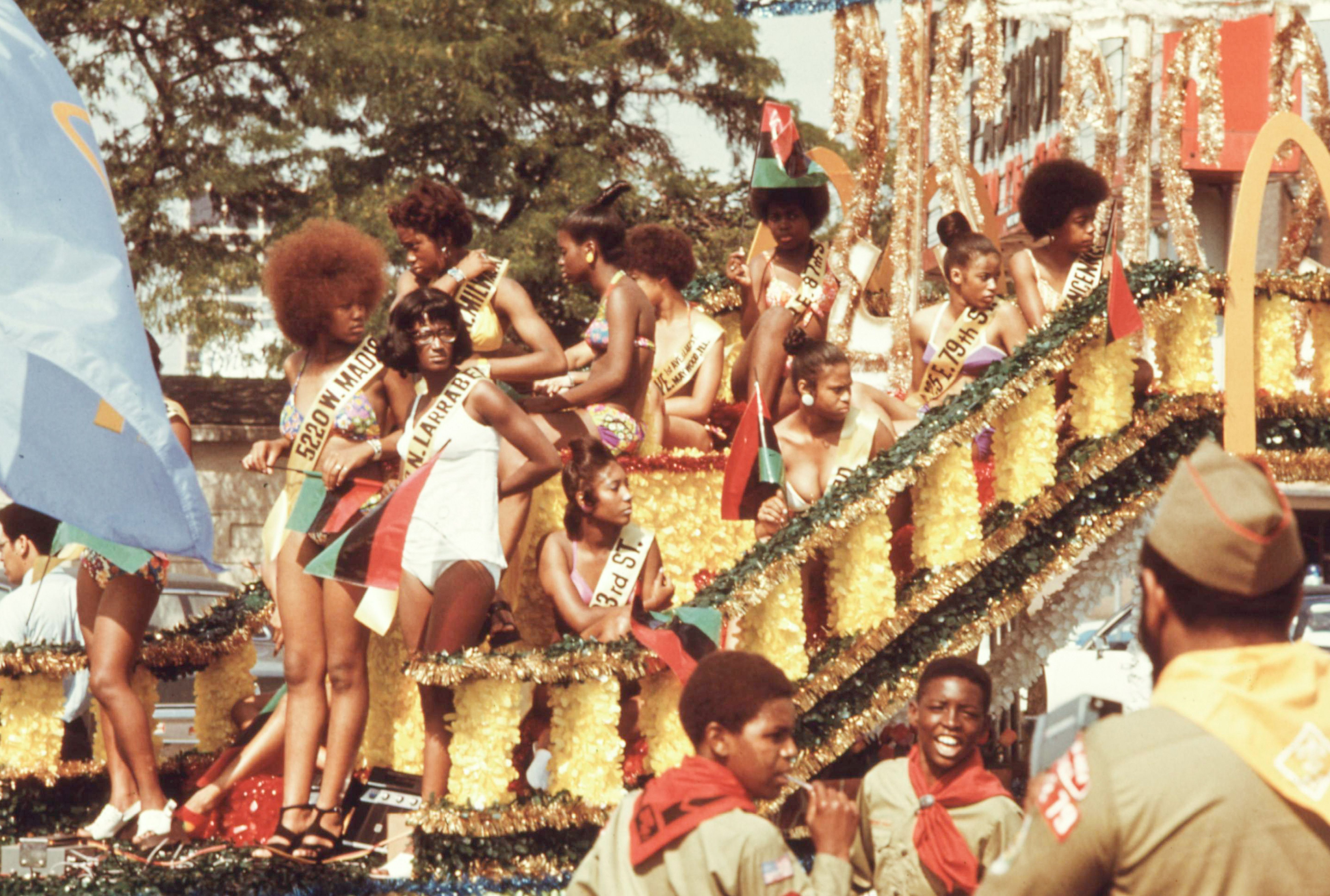 Photo of beauty pageant contestants on a parade float 