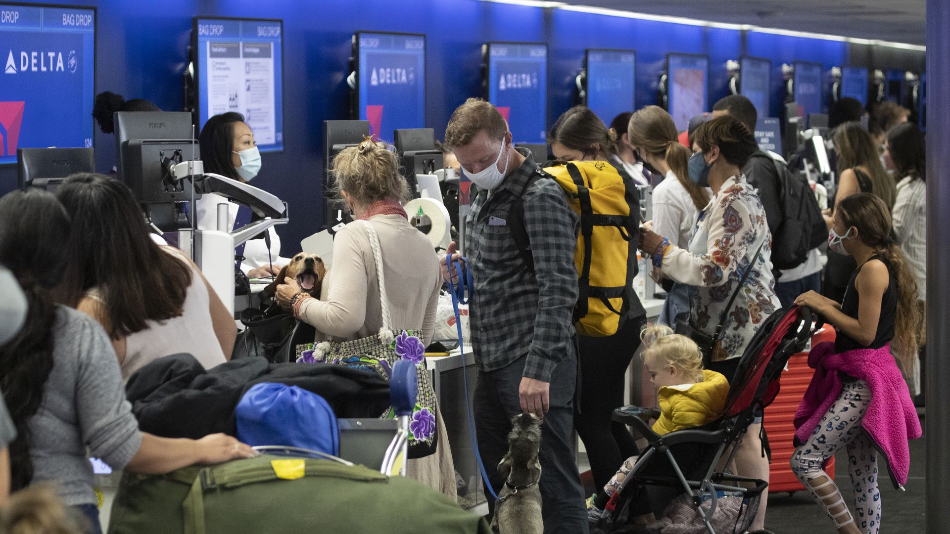 Travelers in line at a Delta counter at LAX.