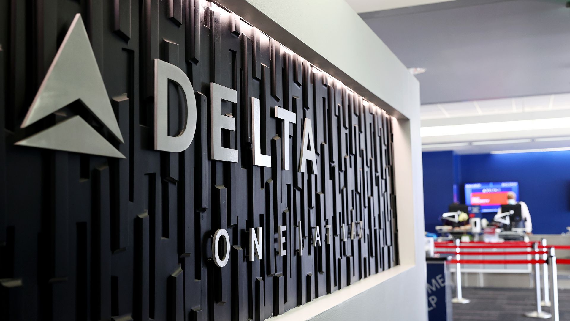 A Delta Air Lines sign is displayed on the departures level at Los Angeles International Airport (LAX) on August 25, 2021.