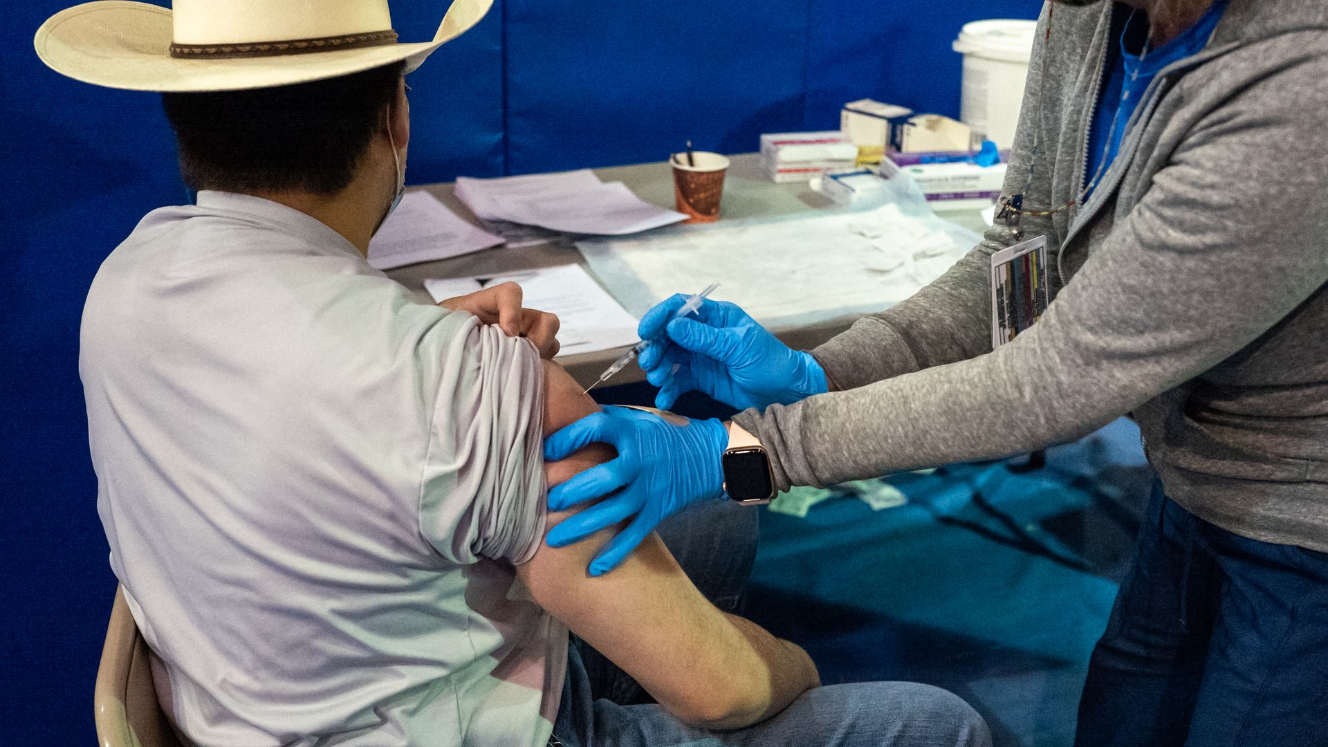 Photo of a person getting the COVID vaccine in their right arm