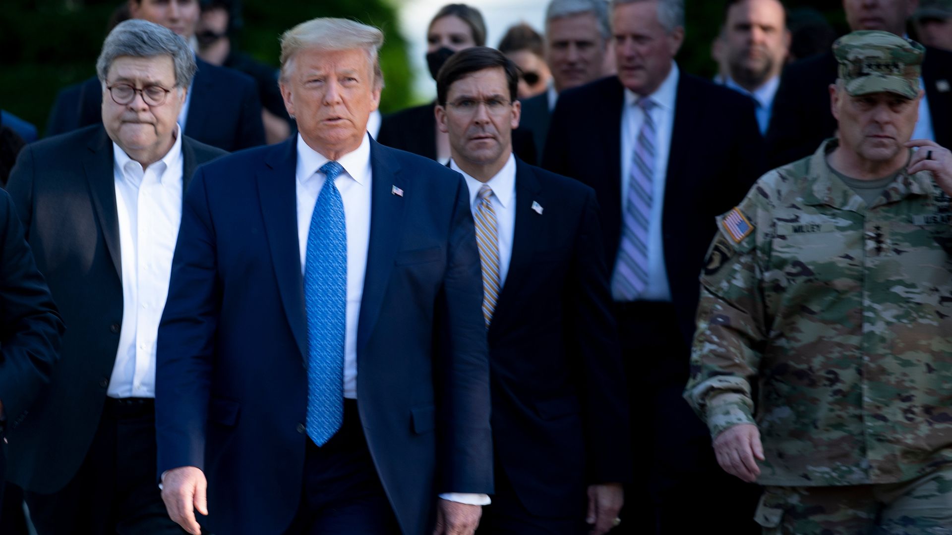 Trump, Barr and others stand in a line