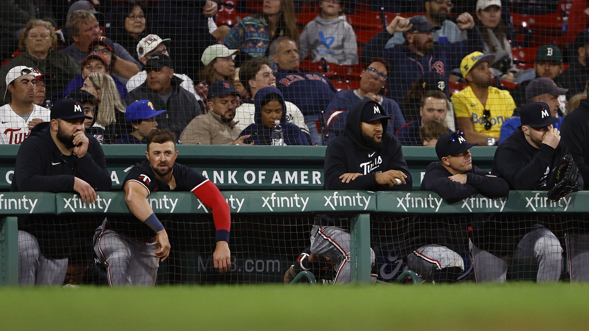 A photo showing Twins players standing in the dugout