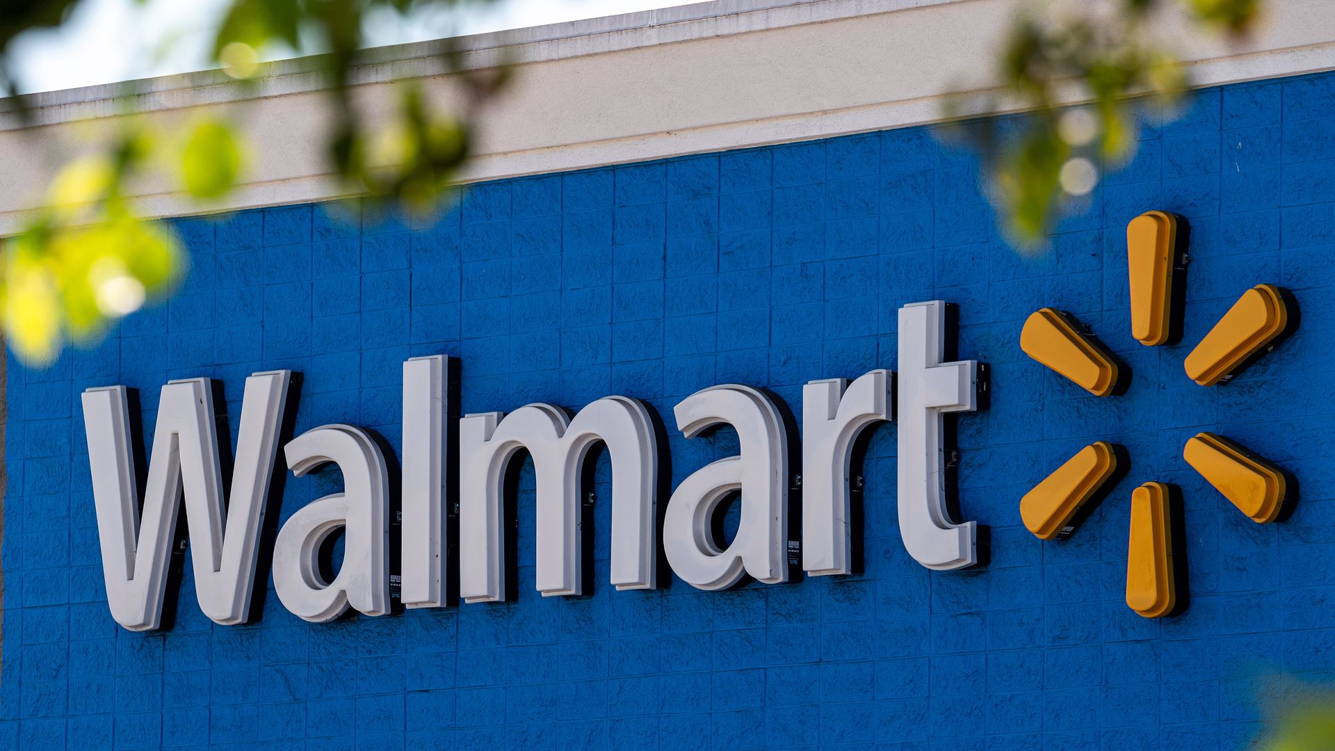 Walmart name on exterior of store with yellow logo