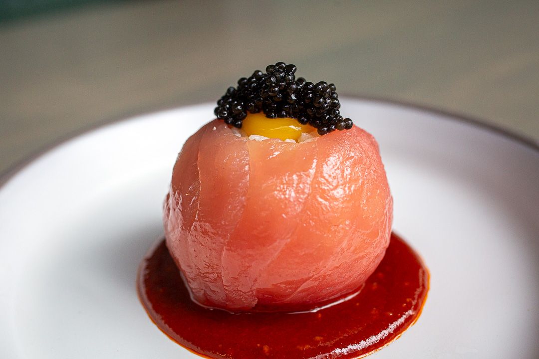 A tuna rice ball with caviar on top 