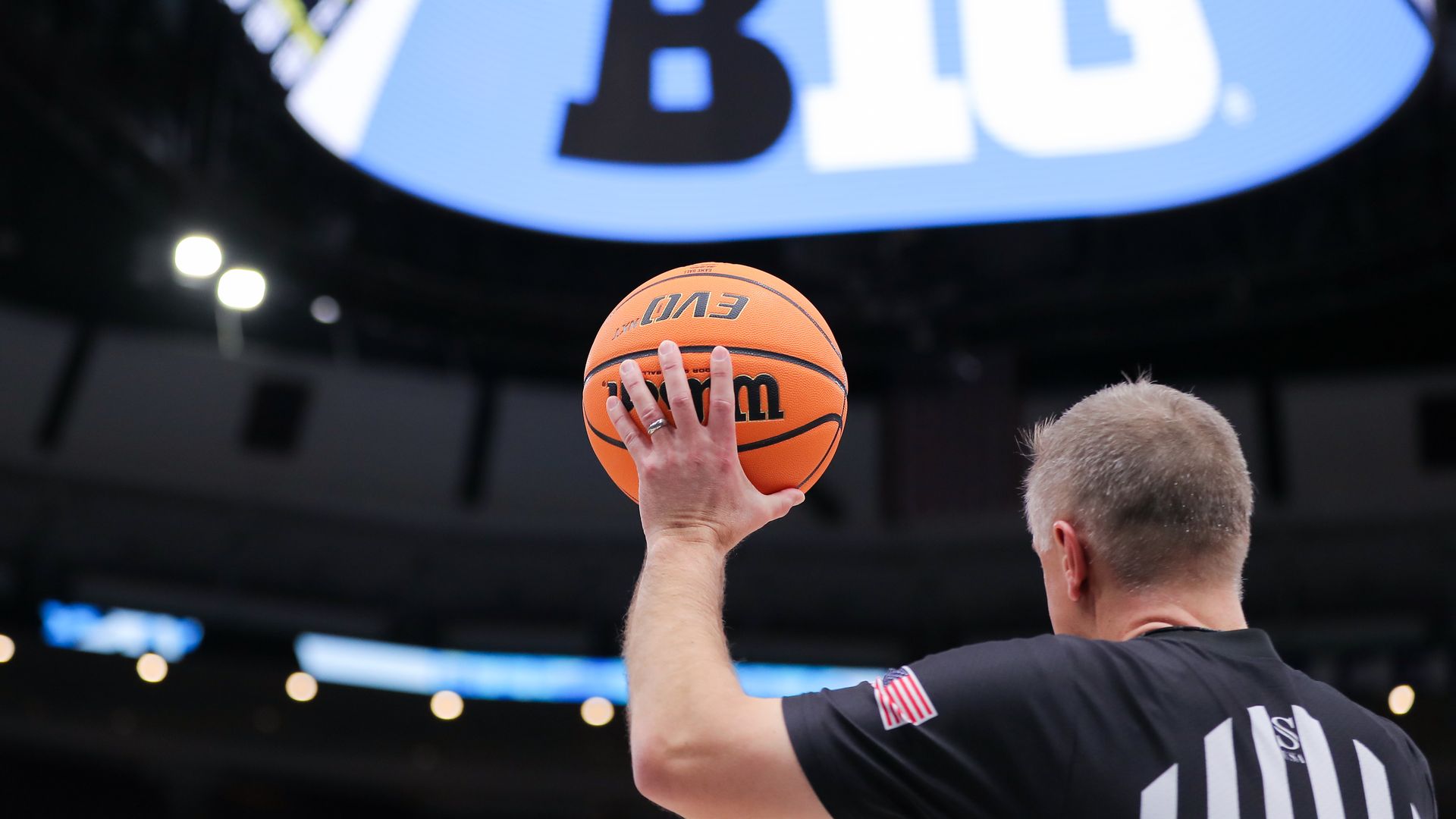 Photo of a referee holding a basketball