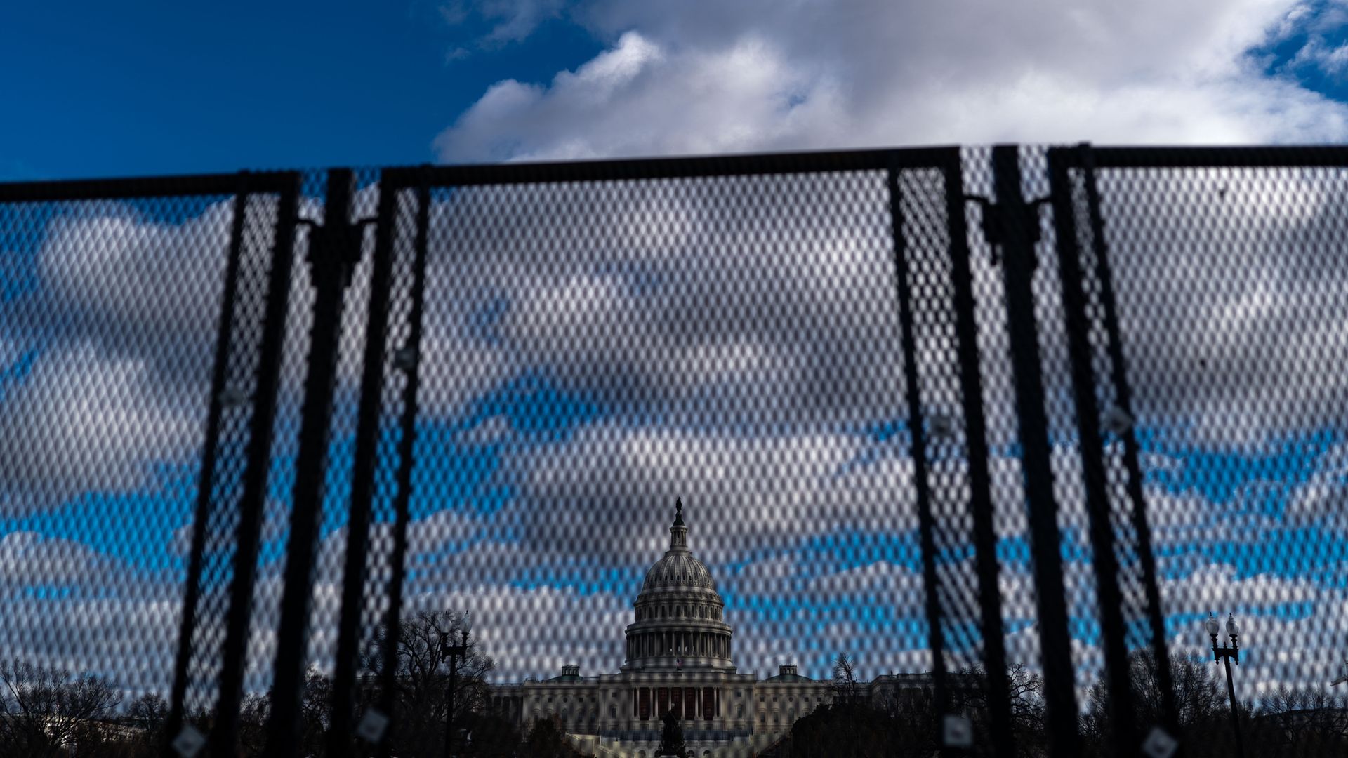 The Dome of the U.S. Capitol Building is visible as new temporary protective fencing is erected near the West Front of the U.S. Capitol Building on January 1, 2025 in Washington, DC. 