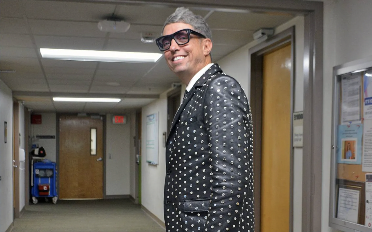 Man in studded jacket