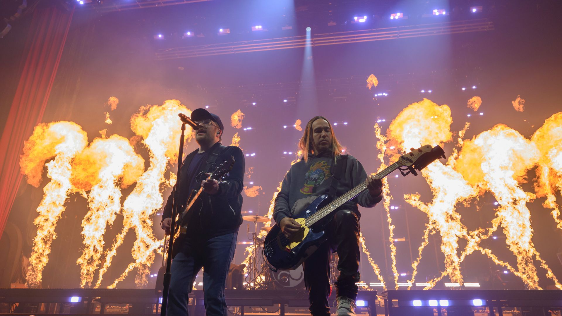 Patrick Stump and Pete Wentz of Fall Out Boy perform in front of a flaming stage during the "So Much For (2our) Dust" tour in Texas.