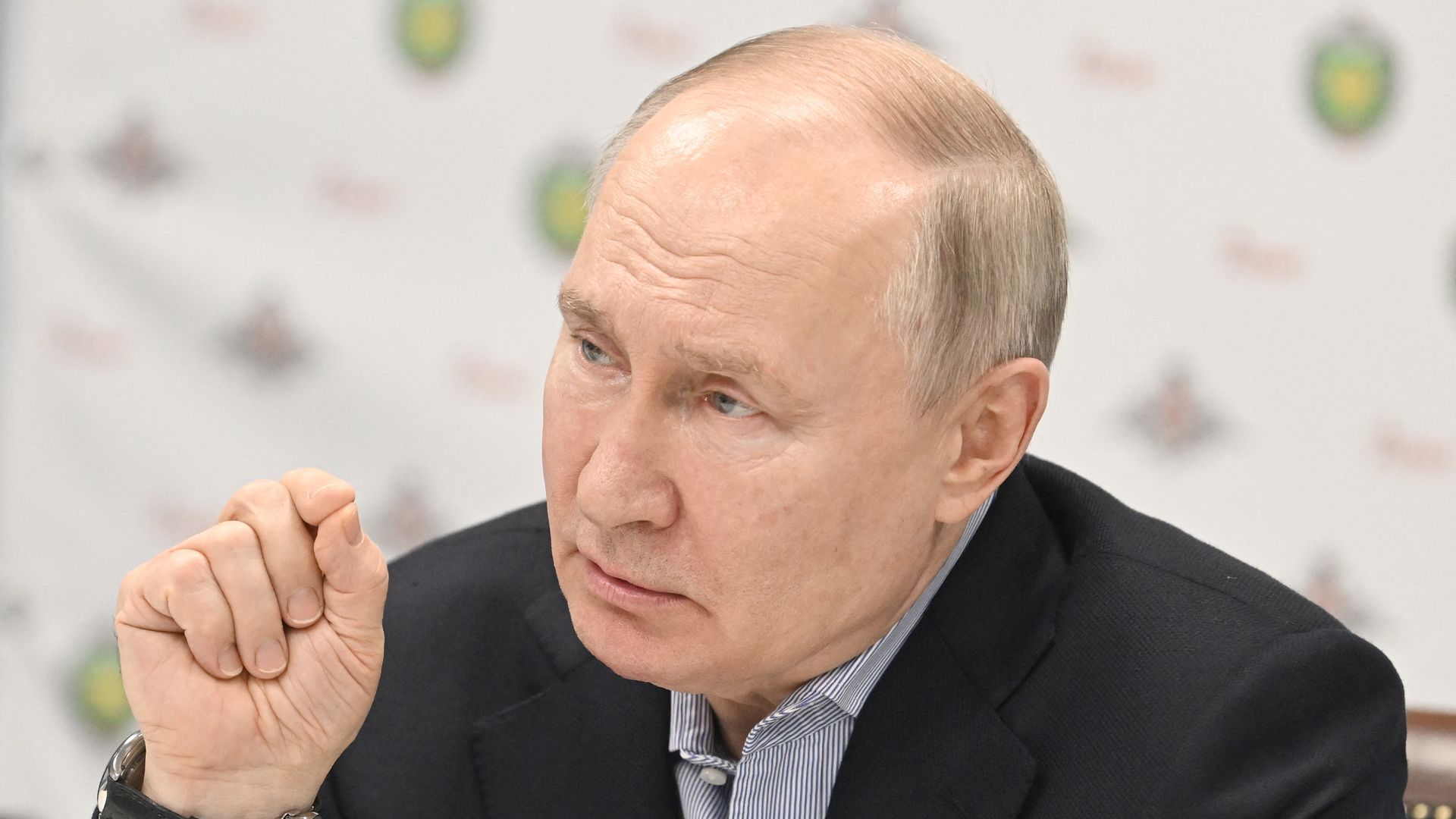 In this pool photograph distributed by Russian state agency Sputnik, Russia's President Vladimir Putin meets with servicemen wounded in Ukraine while visiting the Central Vishnevsky Military Clinic in Moscow on January 1, 2024.