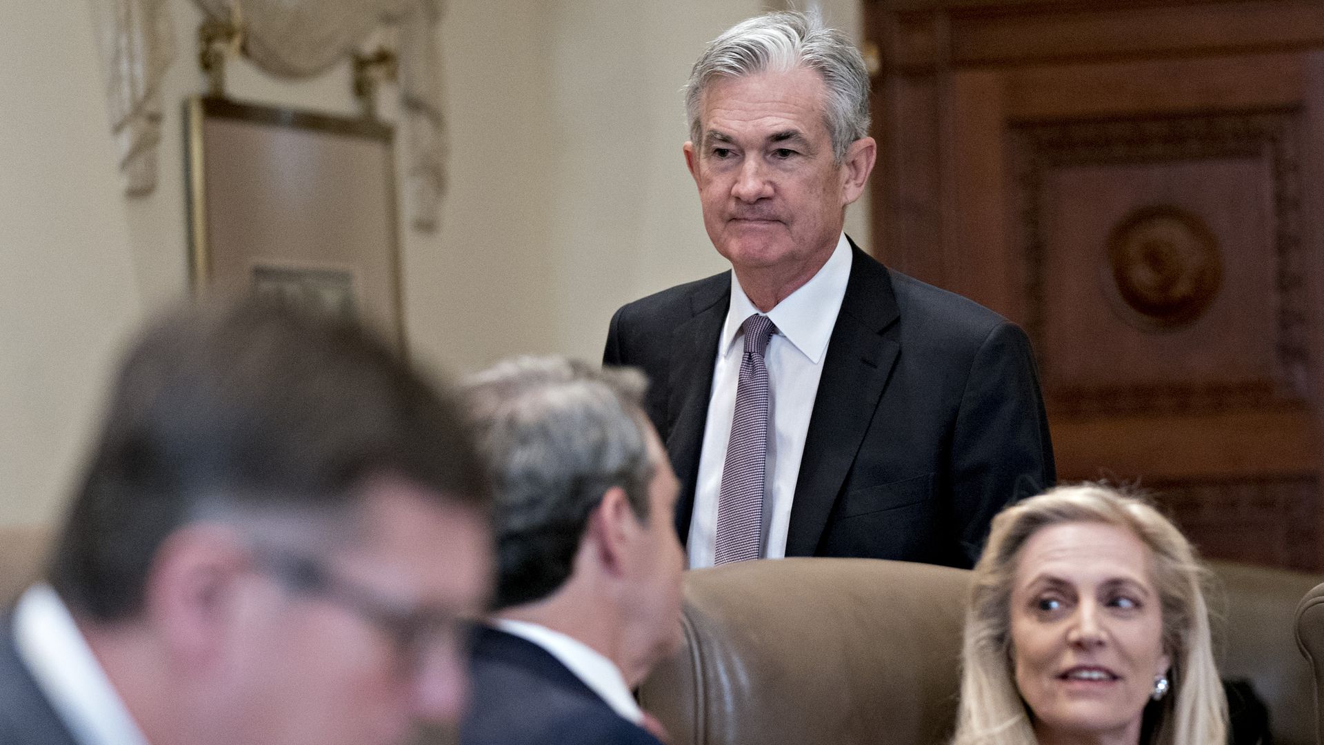 Federal Reserve Chairman Jay Powell is seen walking past Lael Brainerd during a 2019 Fed meeting.