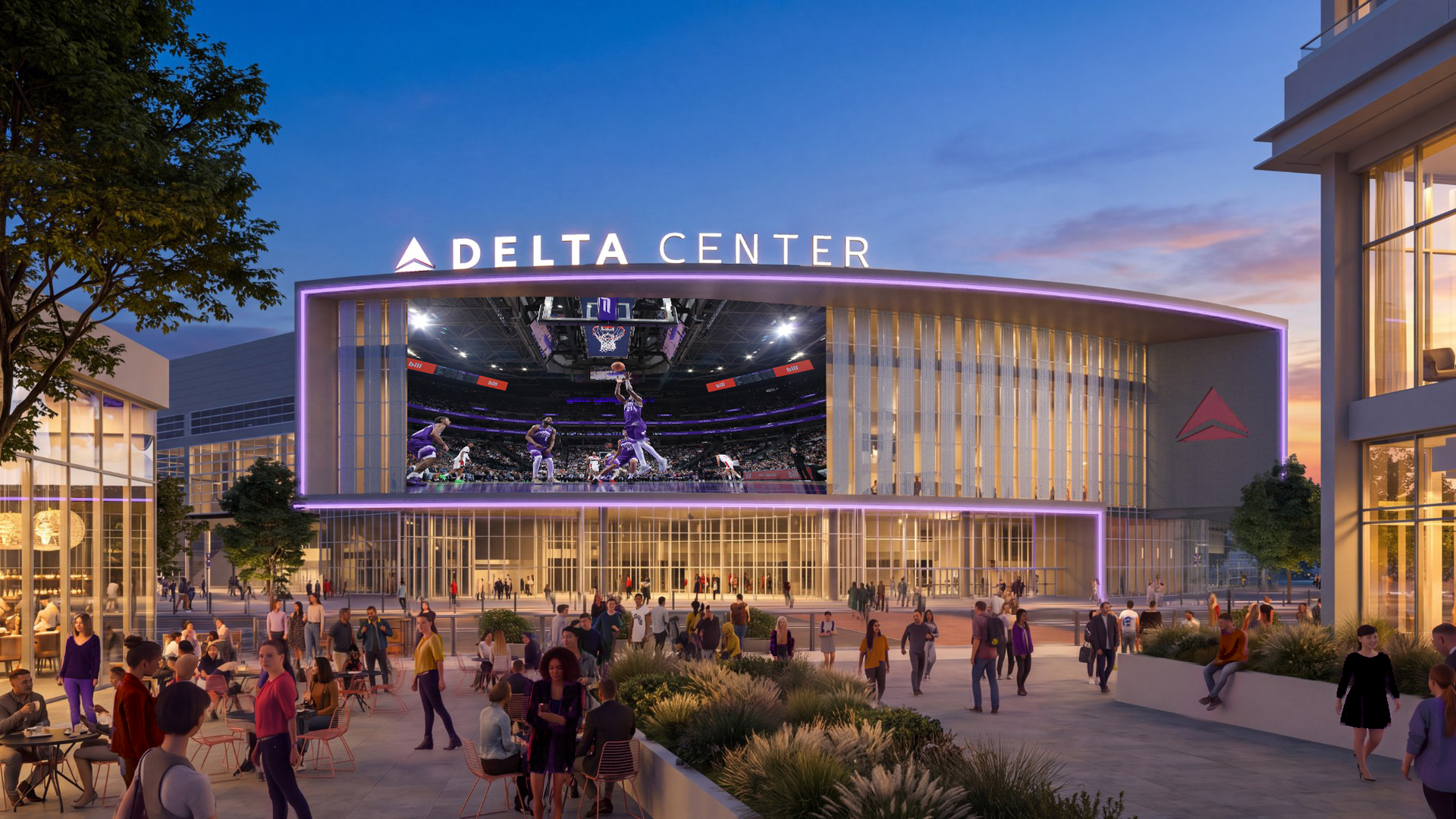 Evening view of the Delta Center, a modern arena with a purple-lit facade. A large video screen shows basketball action while a crowd gathers outside among trees and glass buildings at sunset.