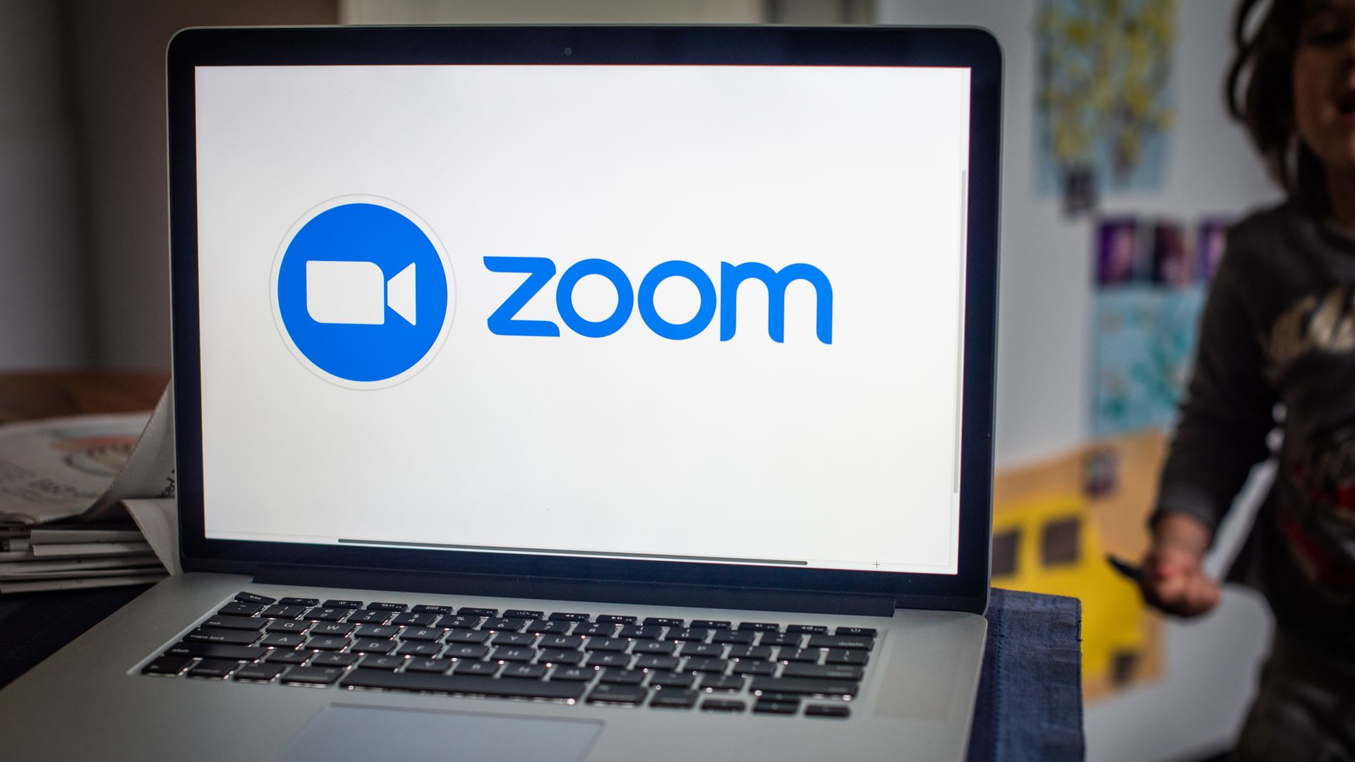 A laptop with the zoom screen and logo pulled up