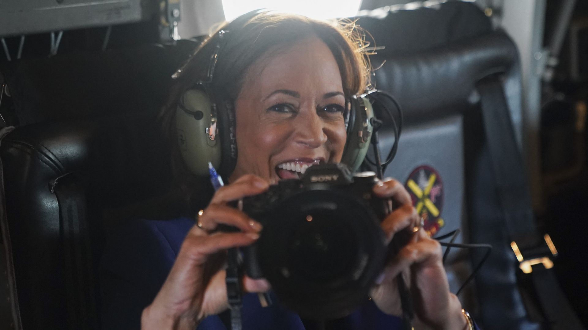 Kamala Harris holding up a camera