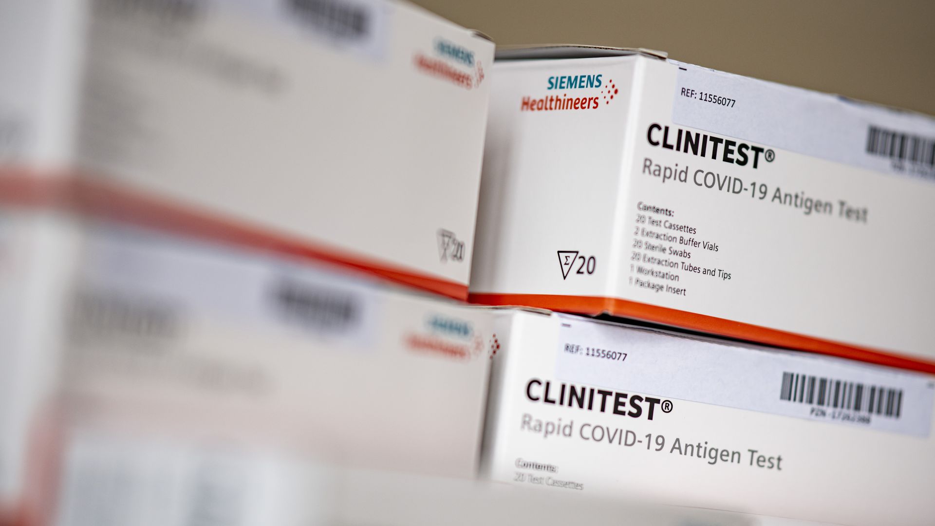 A stack of Covid-19 rapid tests "Clinitest Rapid COVID-19 Antigen Test" from Siemens Healthineers lie in the classroom at Lessing-Gymnasium in Wedding-Berlin.