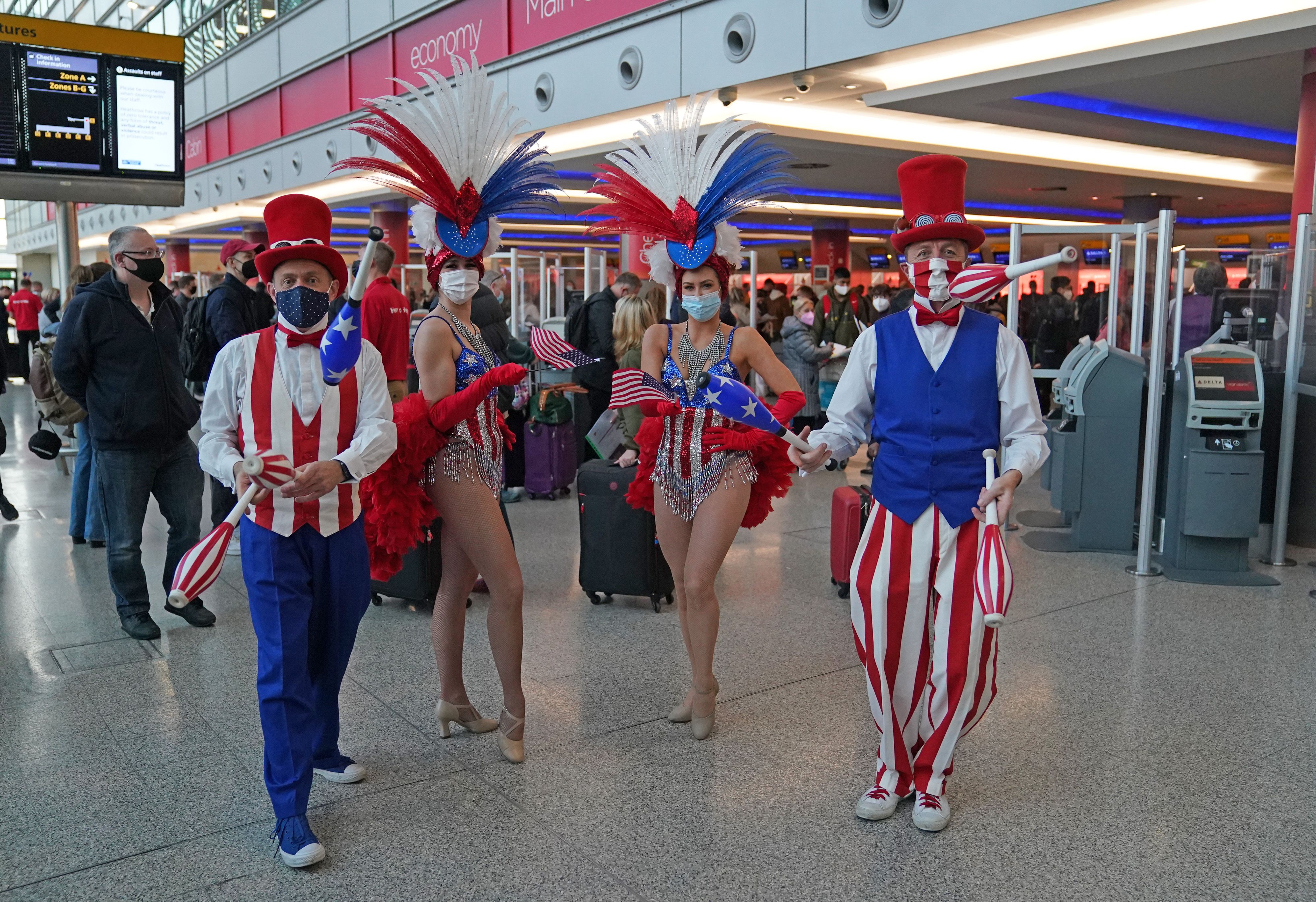  Performers entertain passengers at London Heathrow Airport's T3 as the US reopens its borders to UK visitors on Nov. 8