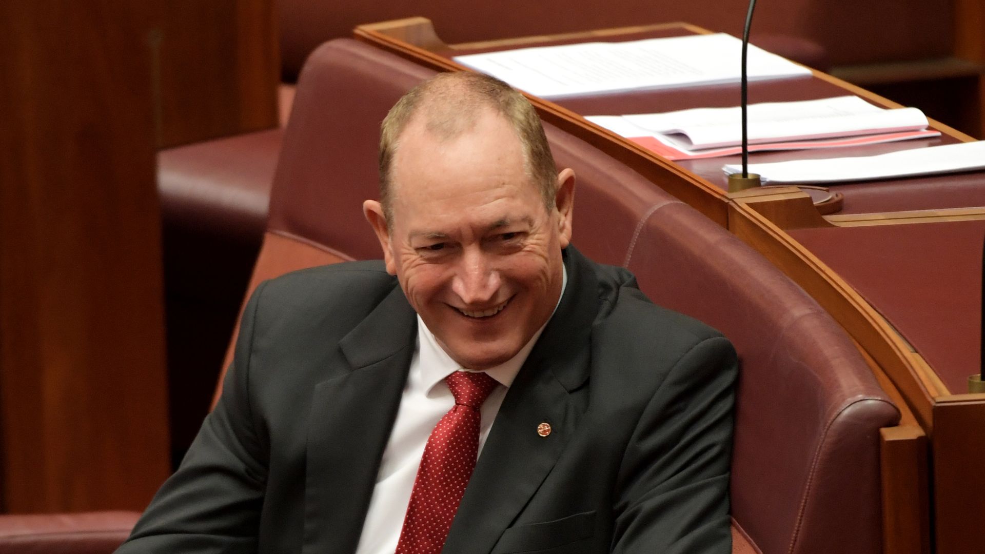 Sen. Fraser Anning smirks as he's censured in the Australian Senate.
