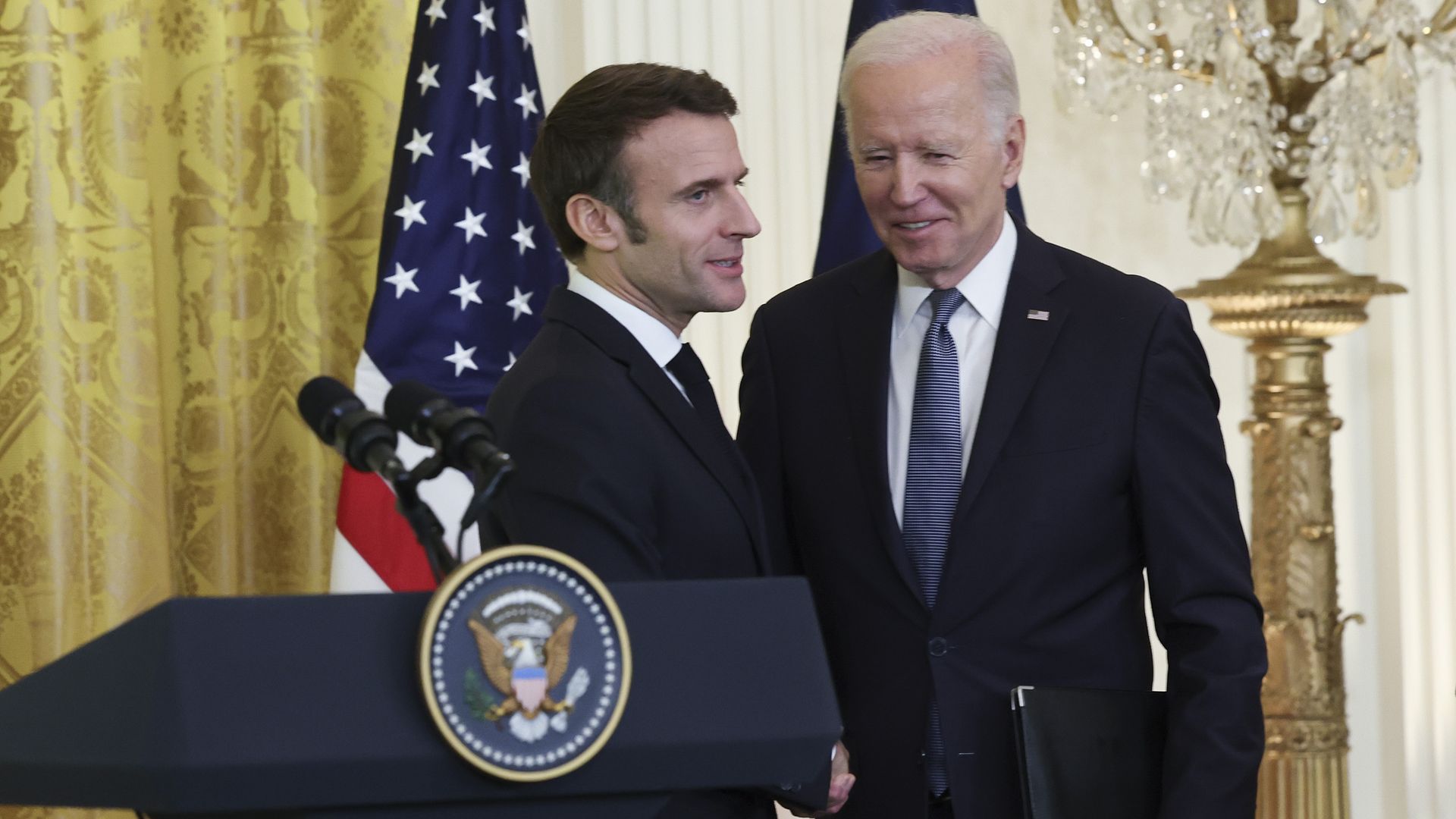 oe Biden and French President Emmanuel Macron shake hands 
