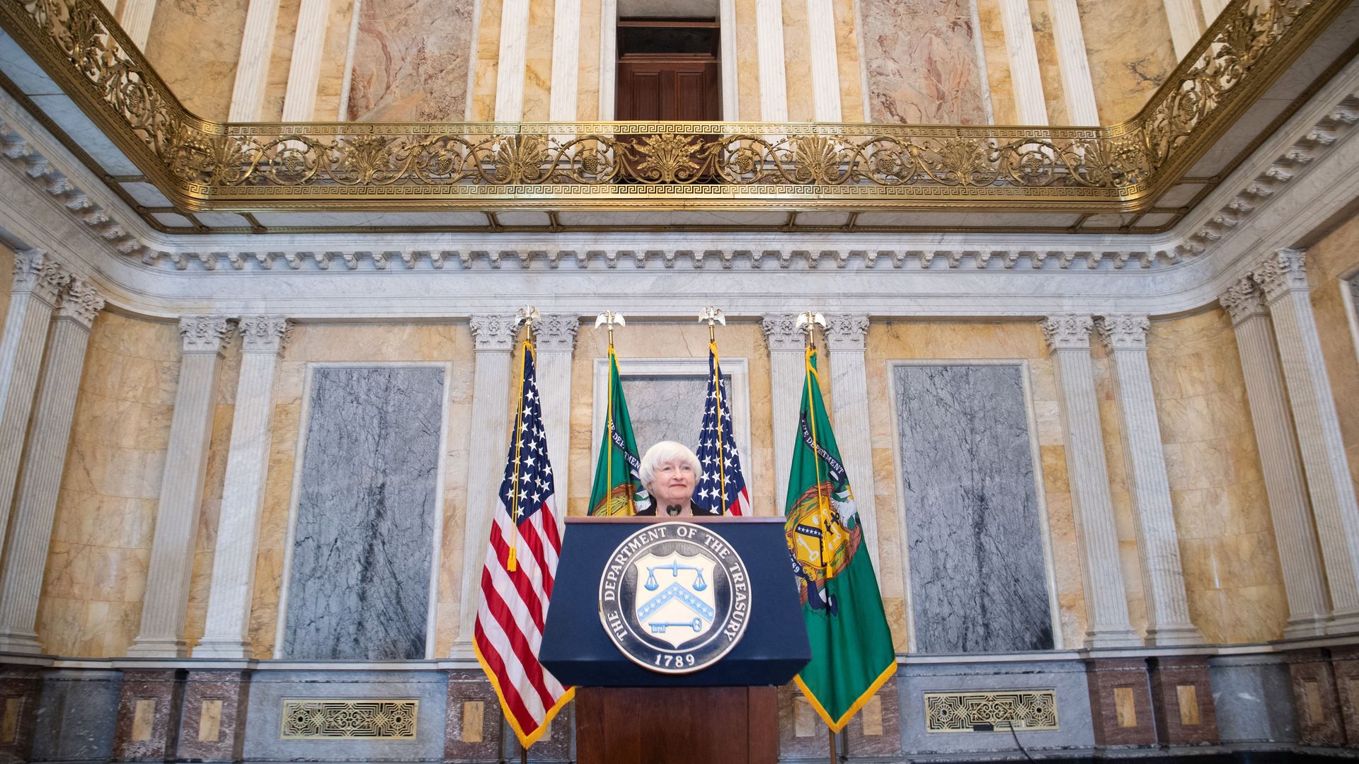 Treasury Secretary Janet Yellen is seen speaking in an ornate room during the IMF Spring meetings in Washington.