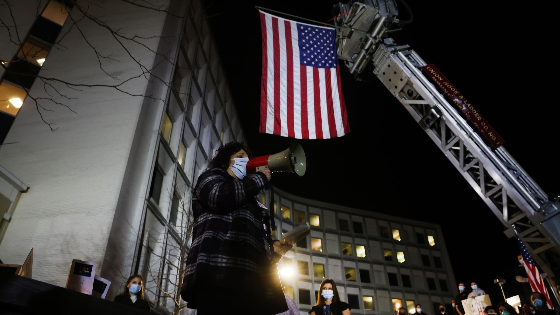 Firefighters, medical workers and first responders gather at Northern Westchester Hospital in New Rochelle, New York, on March 11.  