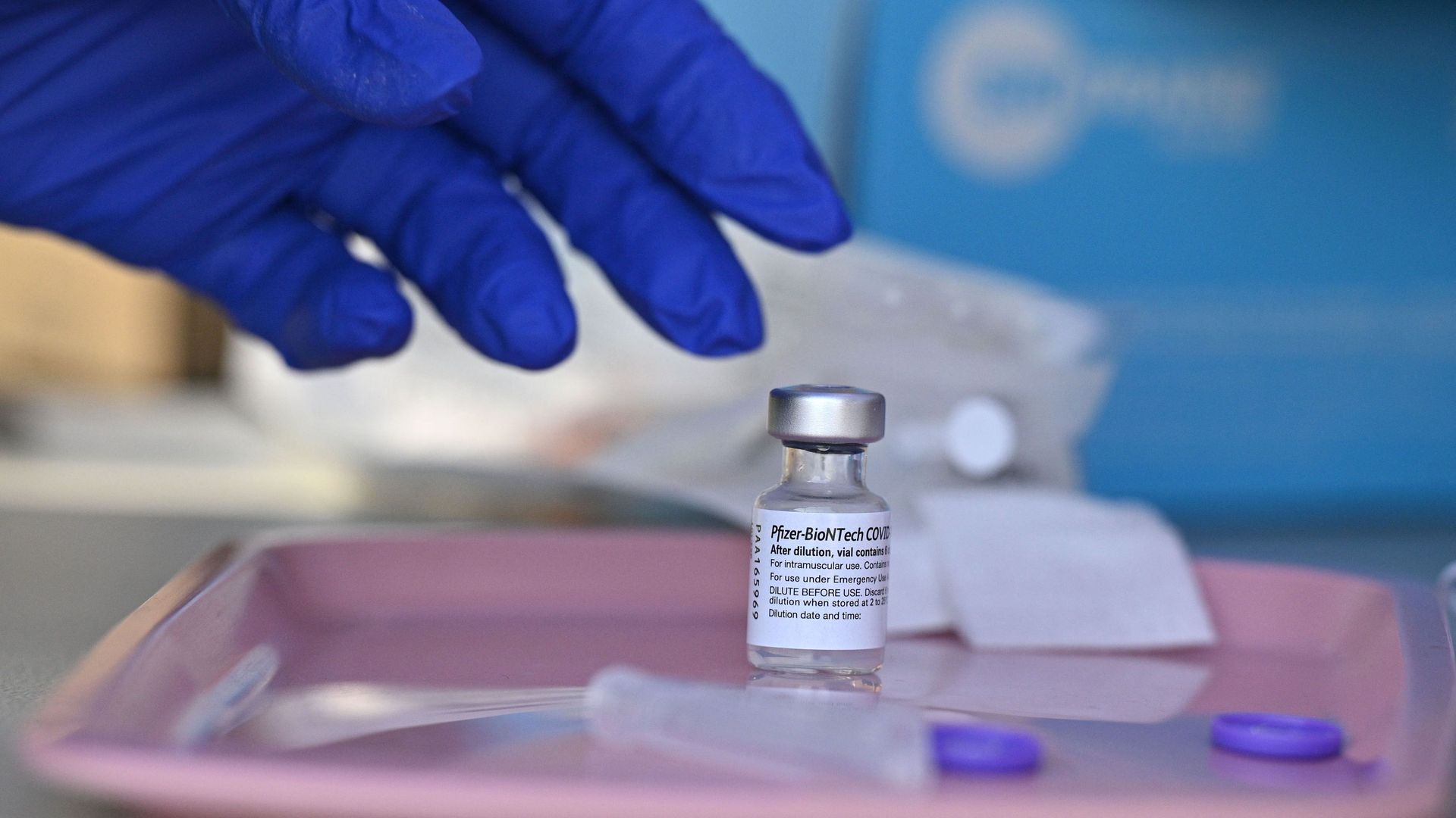 A nurse reaches for a vial of Pfizer-BioNTech Covid-19 vaccine at a pop up vaccine clinic in the Arleta neighborhood of Los Angeles, California, August 23, 2021
