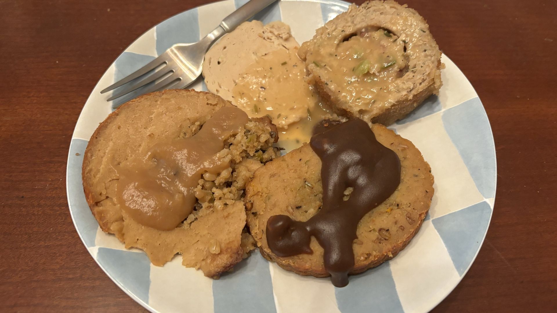 A plate with slices of plant-based roasts. 