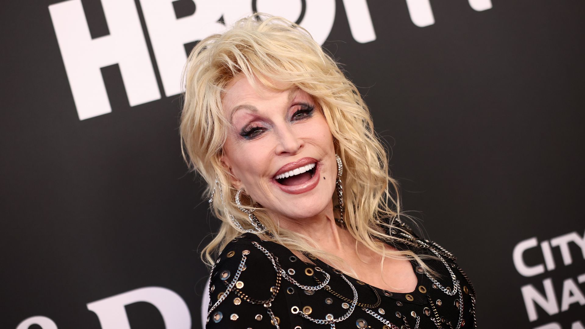 Dolly Parton poses on the red carpet.