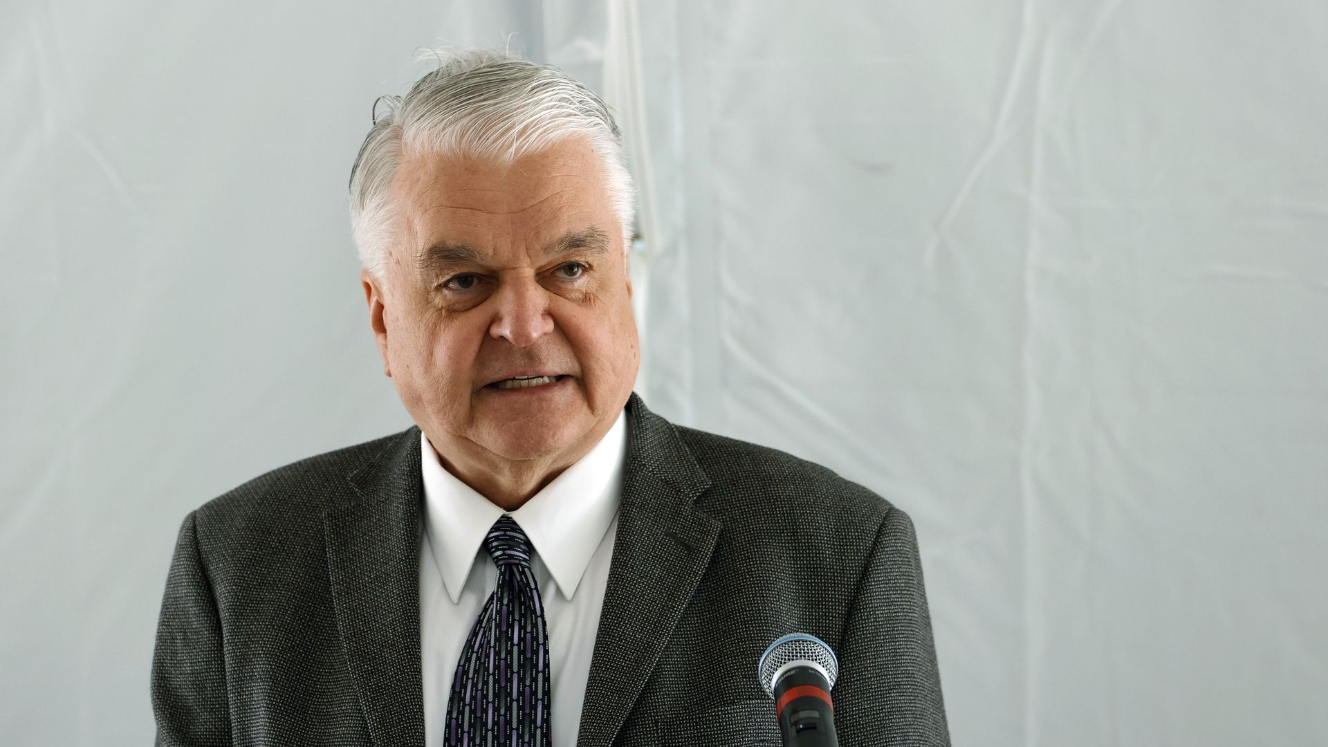 Photo of Steve Sisolak speaking from a podium