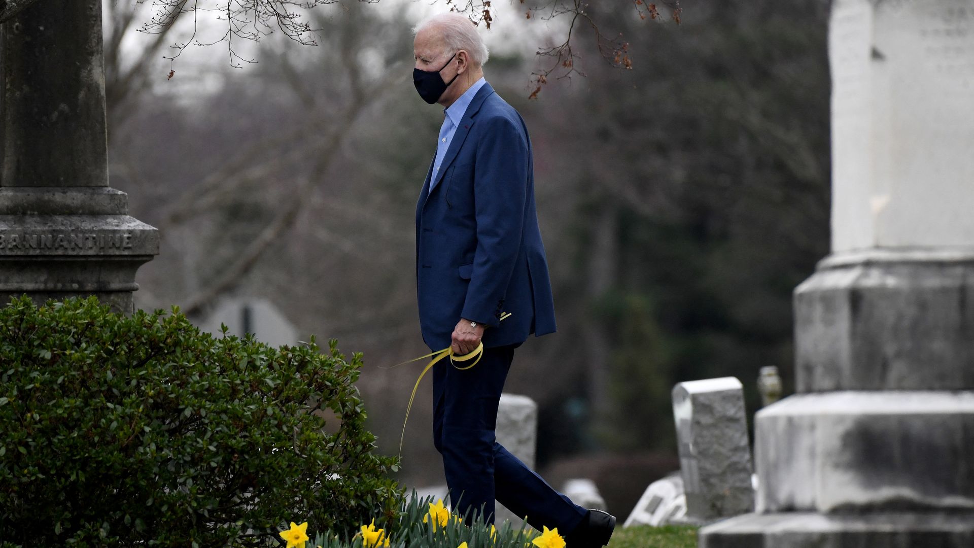 President Biden is seen leaving church on Saturday carrying a palm frond to mark Palm Sunday.