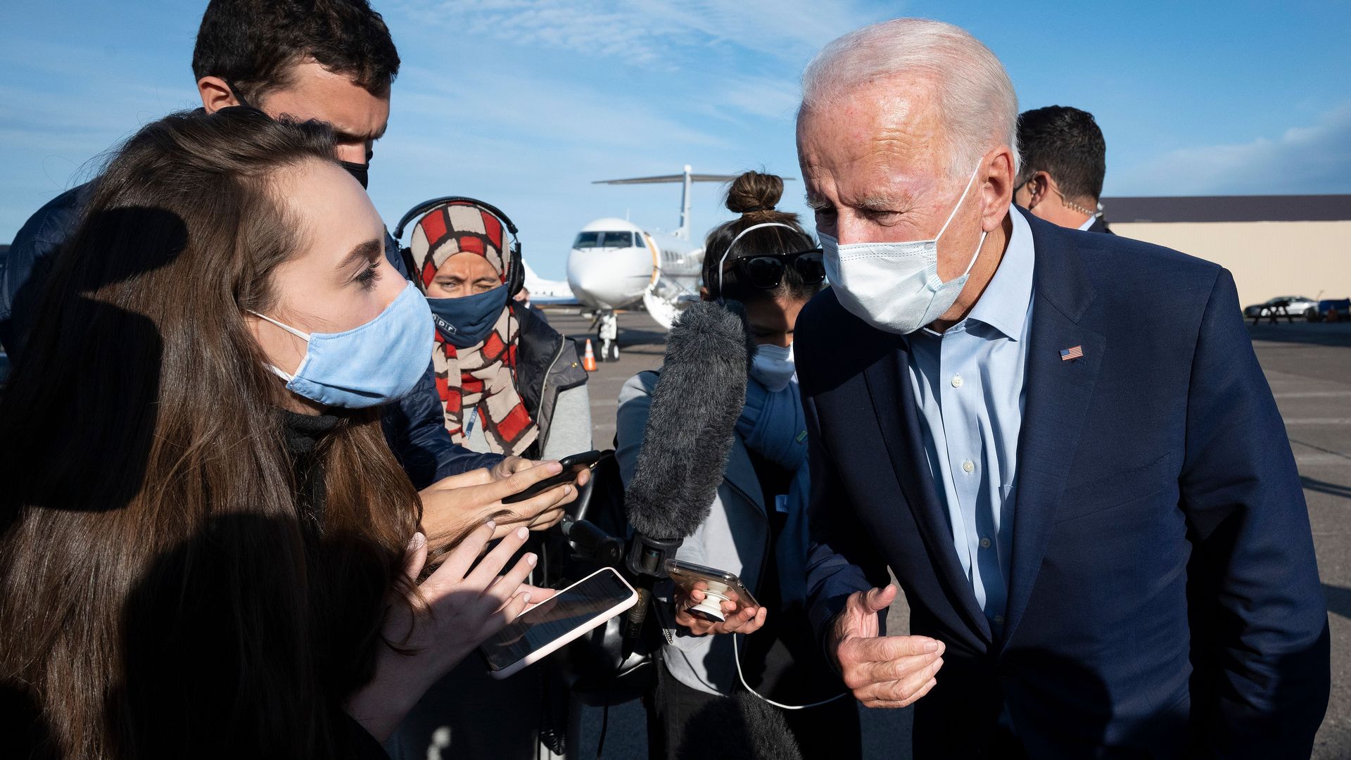 Democratic Presidential Candidate Joe Biden speaks with reporters as he arrives at Duluth International Airport in Duluth, Minnesota, on September 18, 2020.