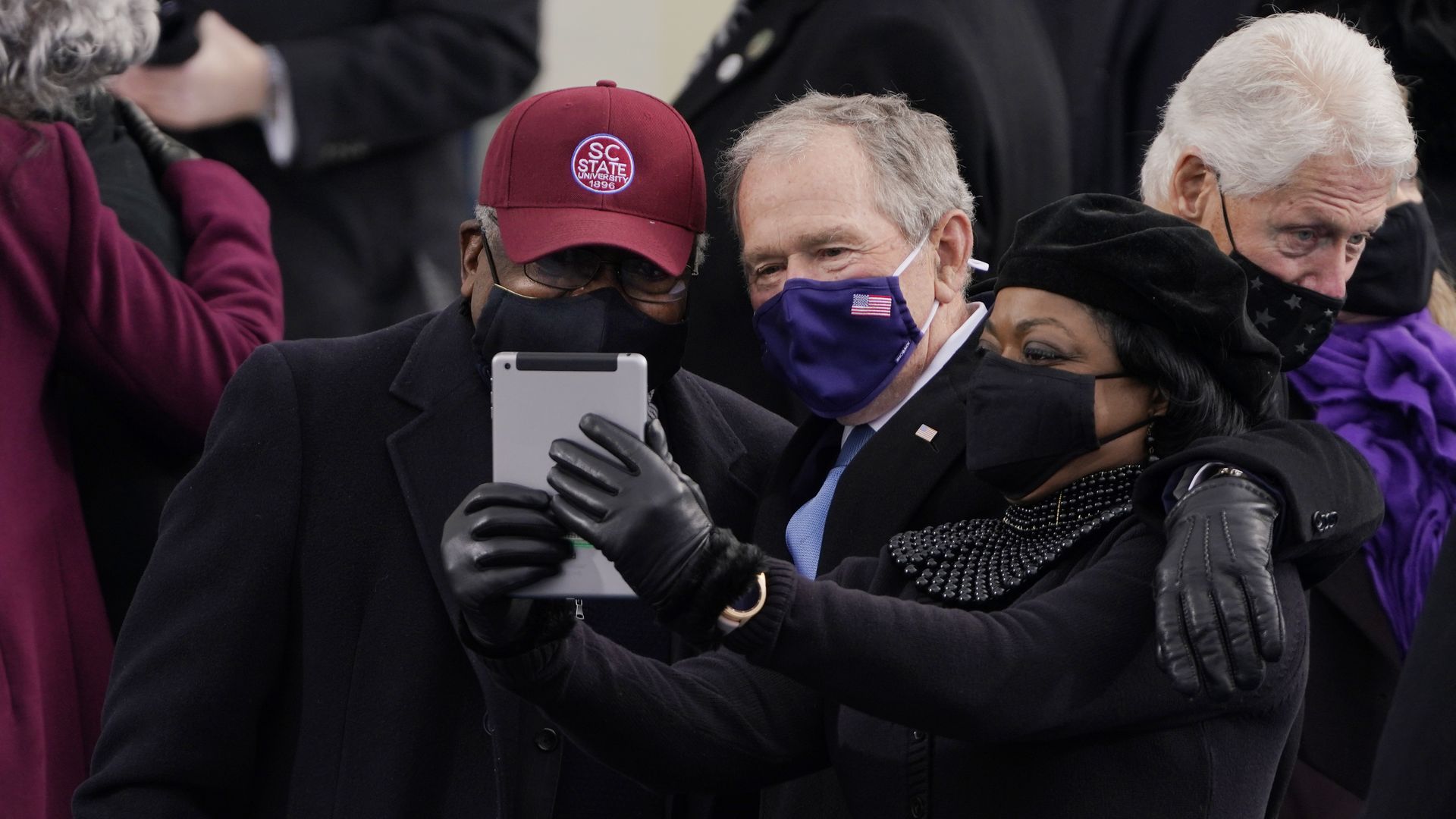 James Clyburn of South Carolina, and former President George Bush, take a selfie before the the 59th inaugural ceremony. 