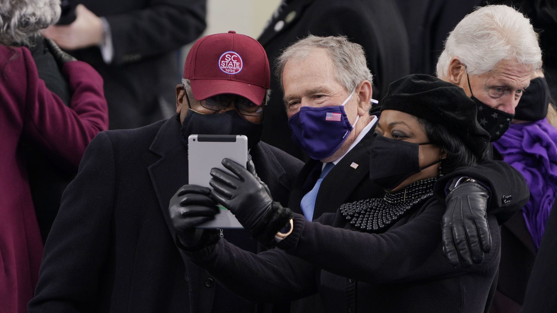 James Clyburn of South Carolina, and former President George Bush, take a selfie before the the 59th inaugural ceremony.