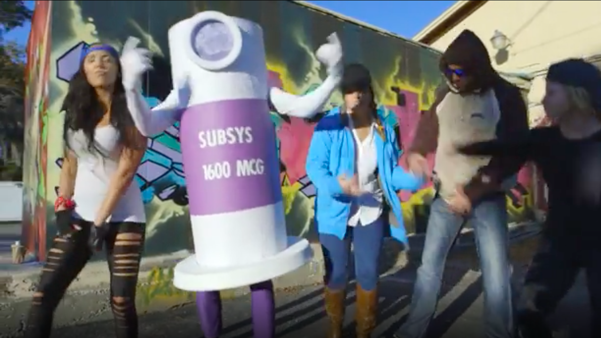 Screenshot of an Insys Therapeutics video showing people dancing alongside a person dressed up as the company's fentanyl spray
