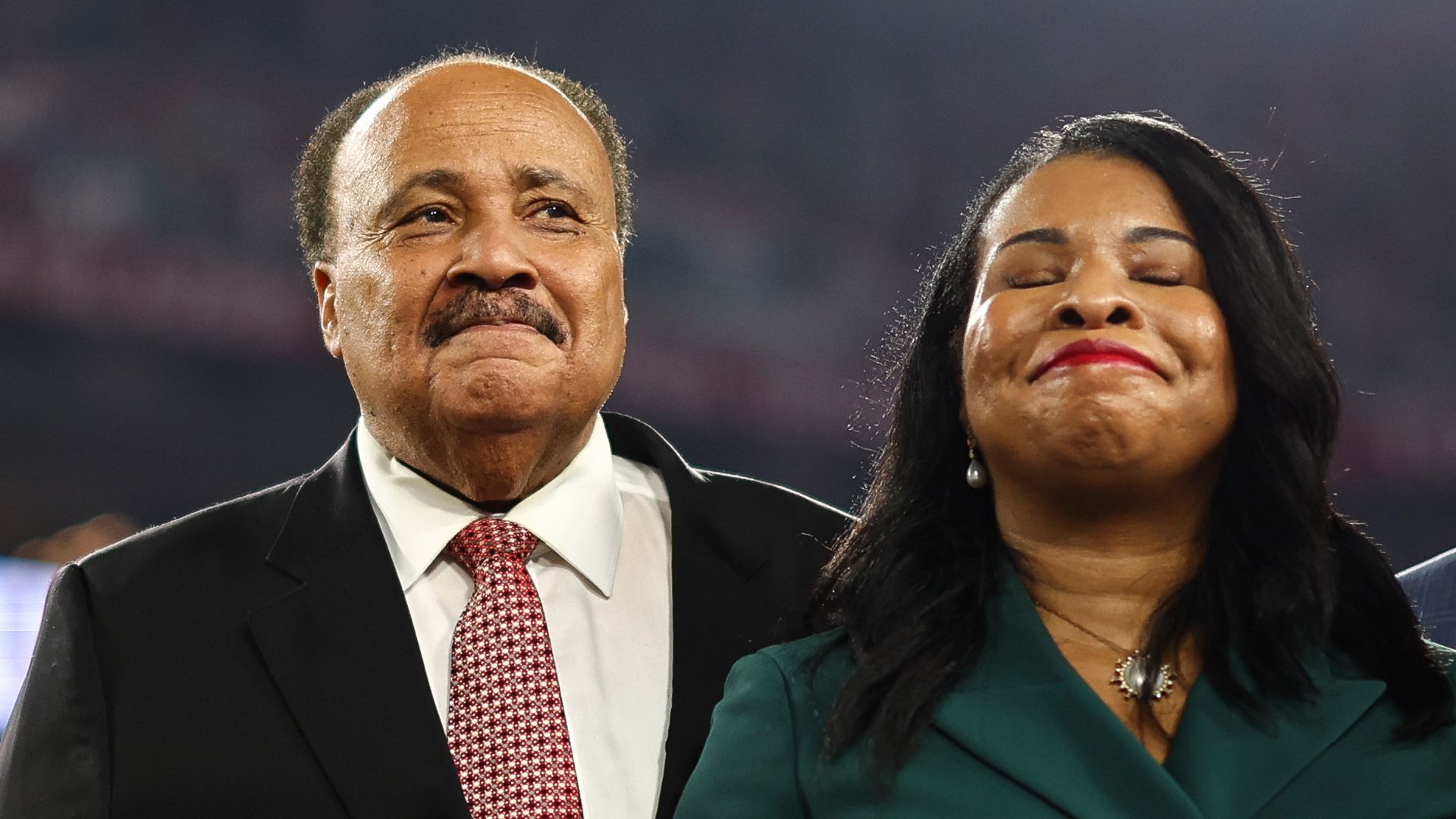 Martin Luther King III and Arndrea Waters King stand next to each other. Arndrea Waters King has her eyes closed 