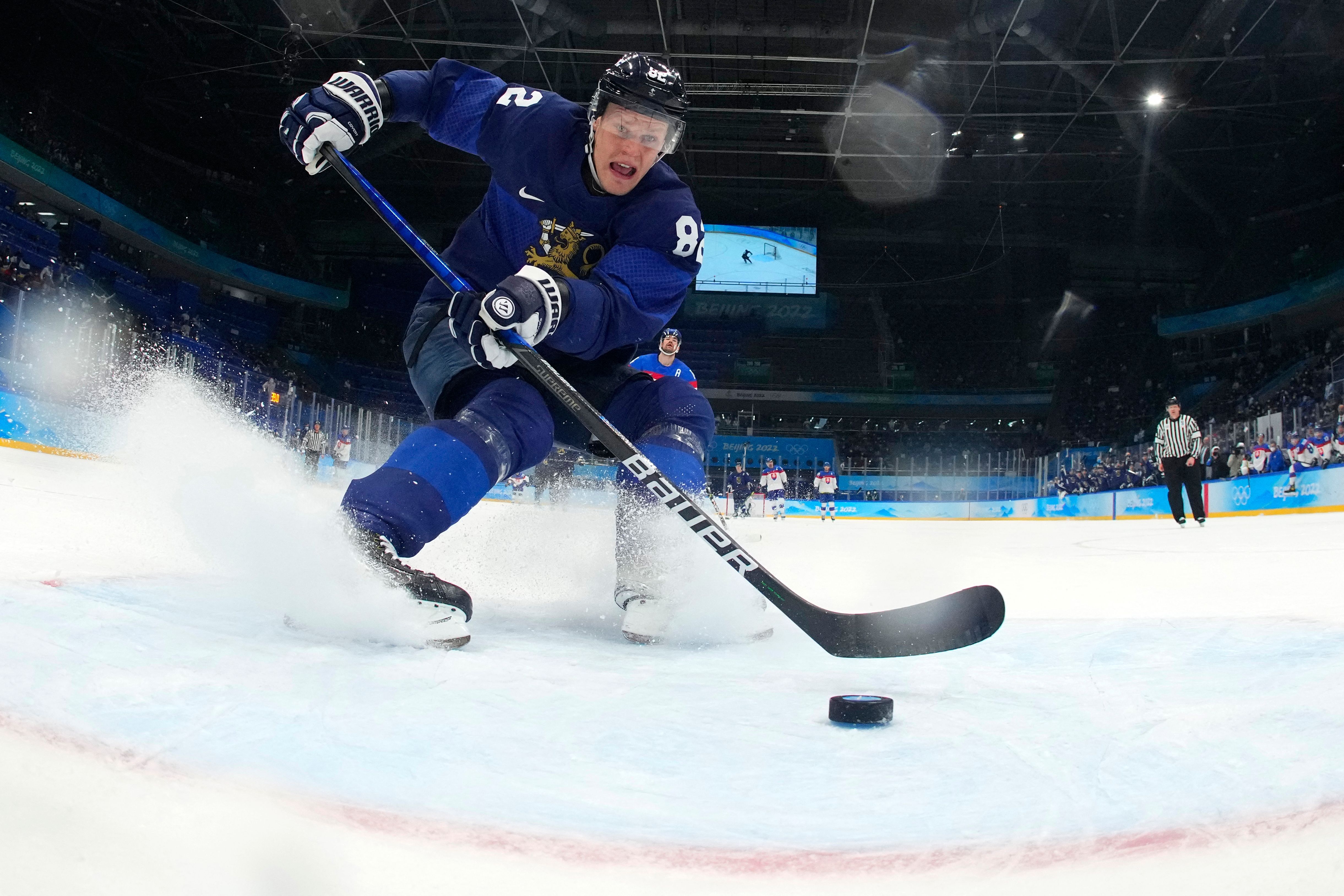 Finland's Harri Pesonen scores his team's second goal during the men's play-off semifinal match of the Beijing 2022 Winter Olympic Games ice hockey competition against Slovakia Feb. 18.