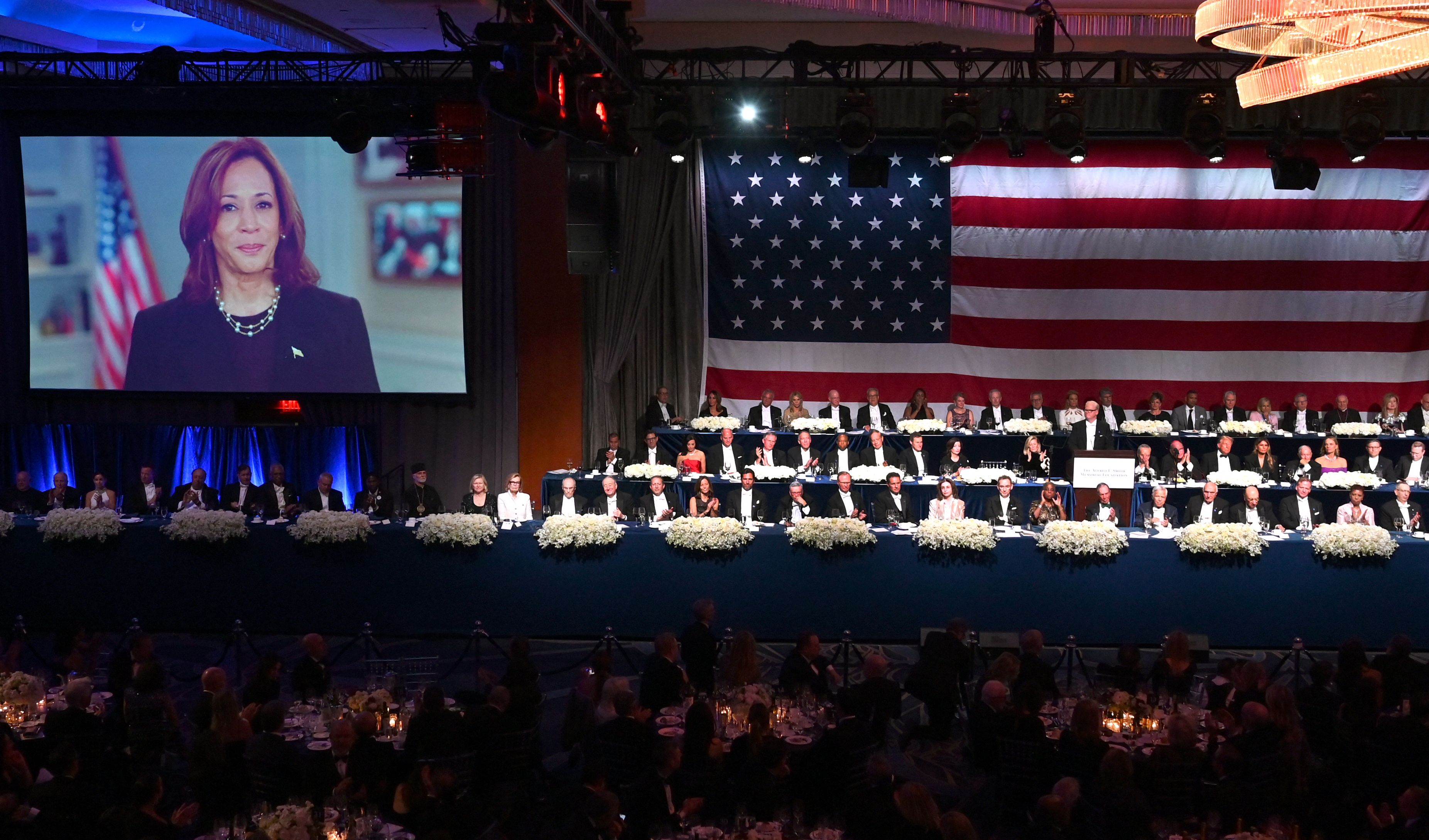 Video of US Vice President Kamala Harris plays onscreen at the 79th Annual Alfred E. Smith Memorial Foundation Dinner at the Hilton Midtown in New York, October 17, 2024. 
