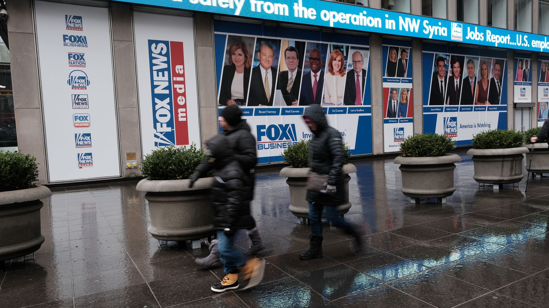  People walk past 1211 Avenue of the Americas the headquarters for News Corp on February 04, 2022 in New York City. 