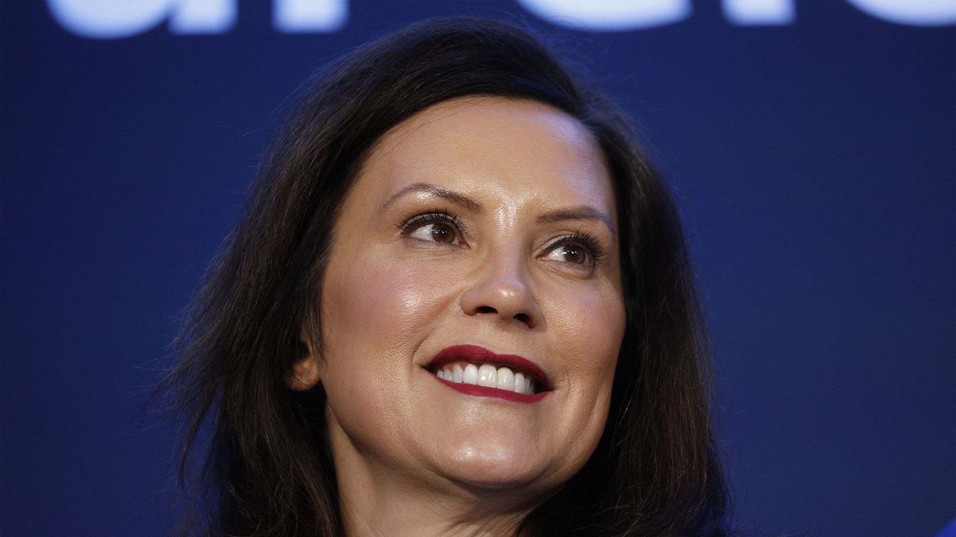 In this image, Michigan Governor Gretchen Whitmer stands