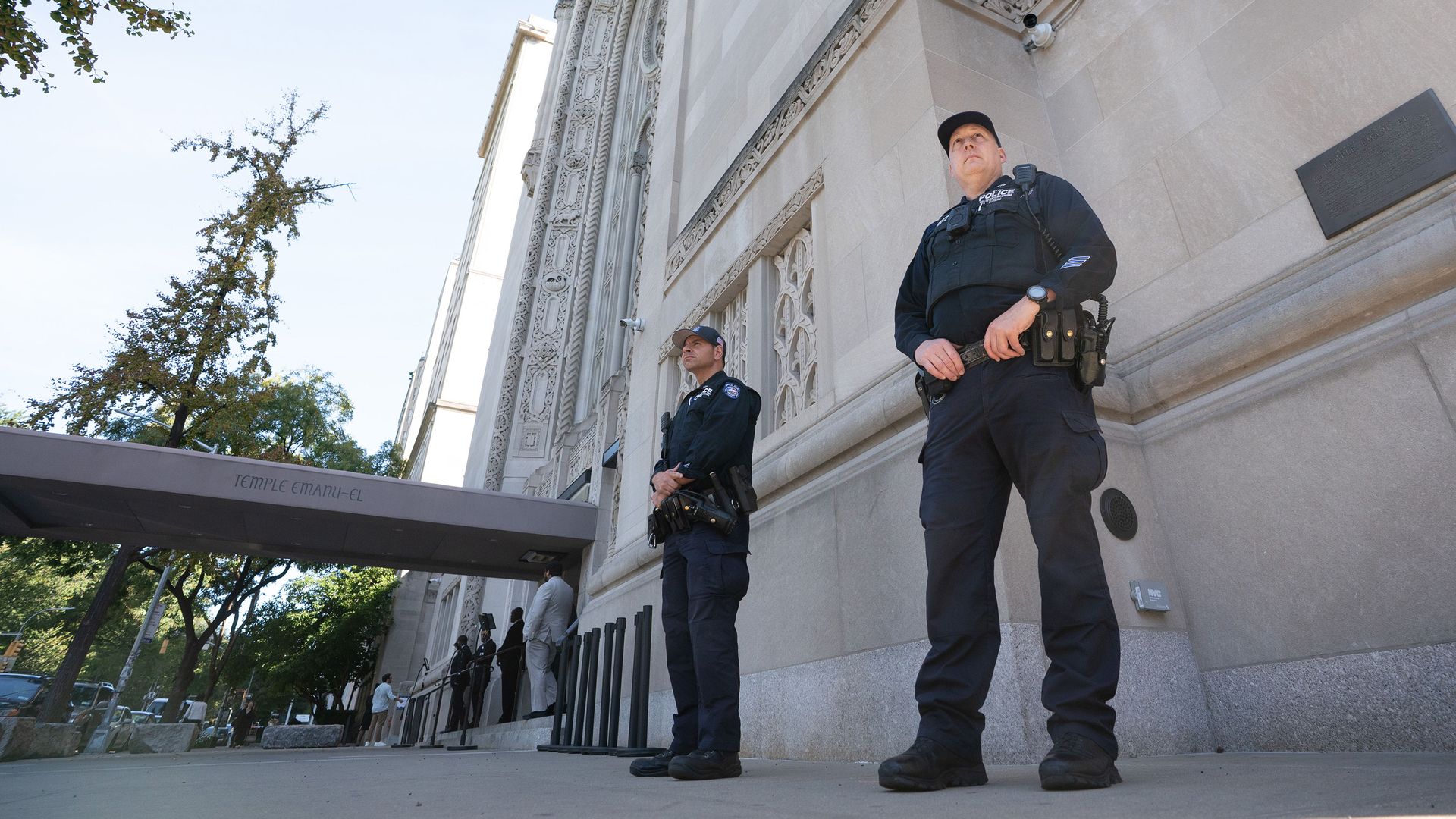 New York Police Department Counter Terrorism officers stand post outside the entrance to Temple Emanu-El Thursday, Oct. 2, 2025, in the Bronx, New York City.