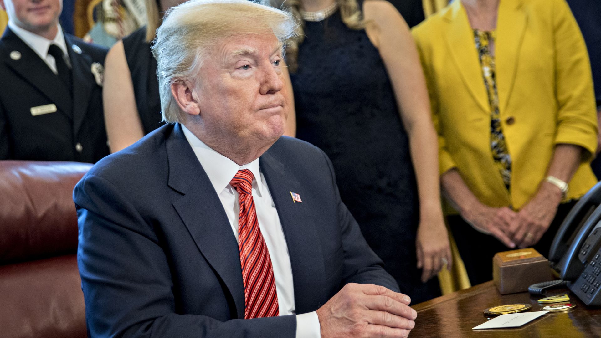Donald Trump at his desk in the Oval Office.