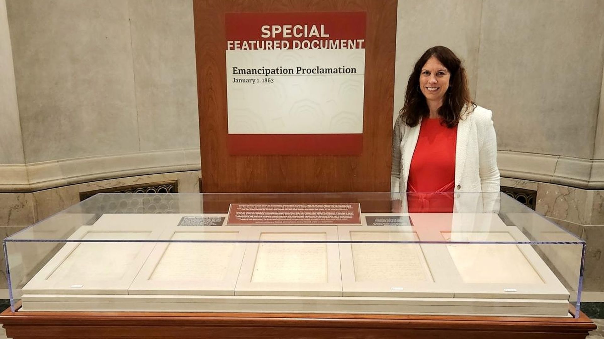 Enlarge Archivist of the United States Dr. Colleen Shogan with the display of the Emancipation Proclamation.