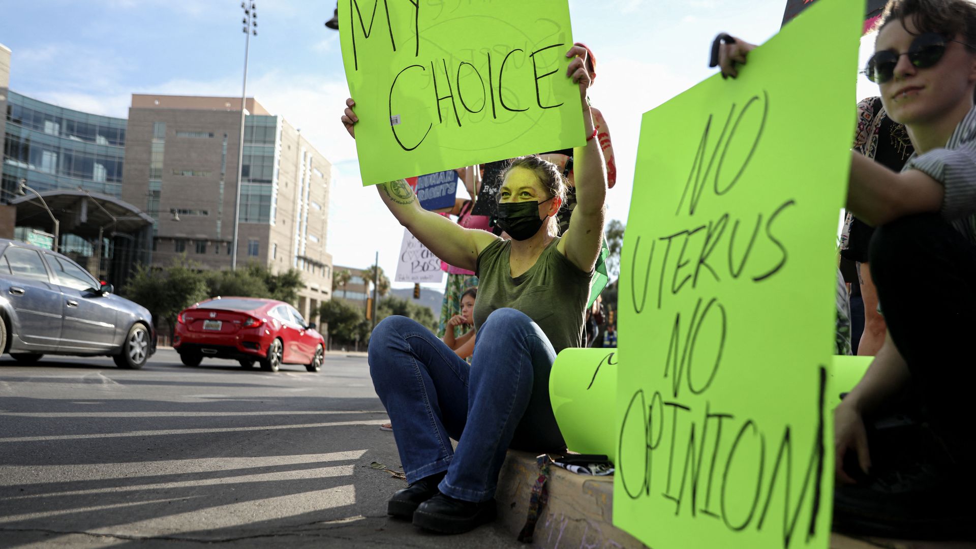 Protesters holding pro-abortion rights signs.