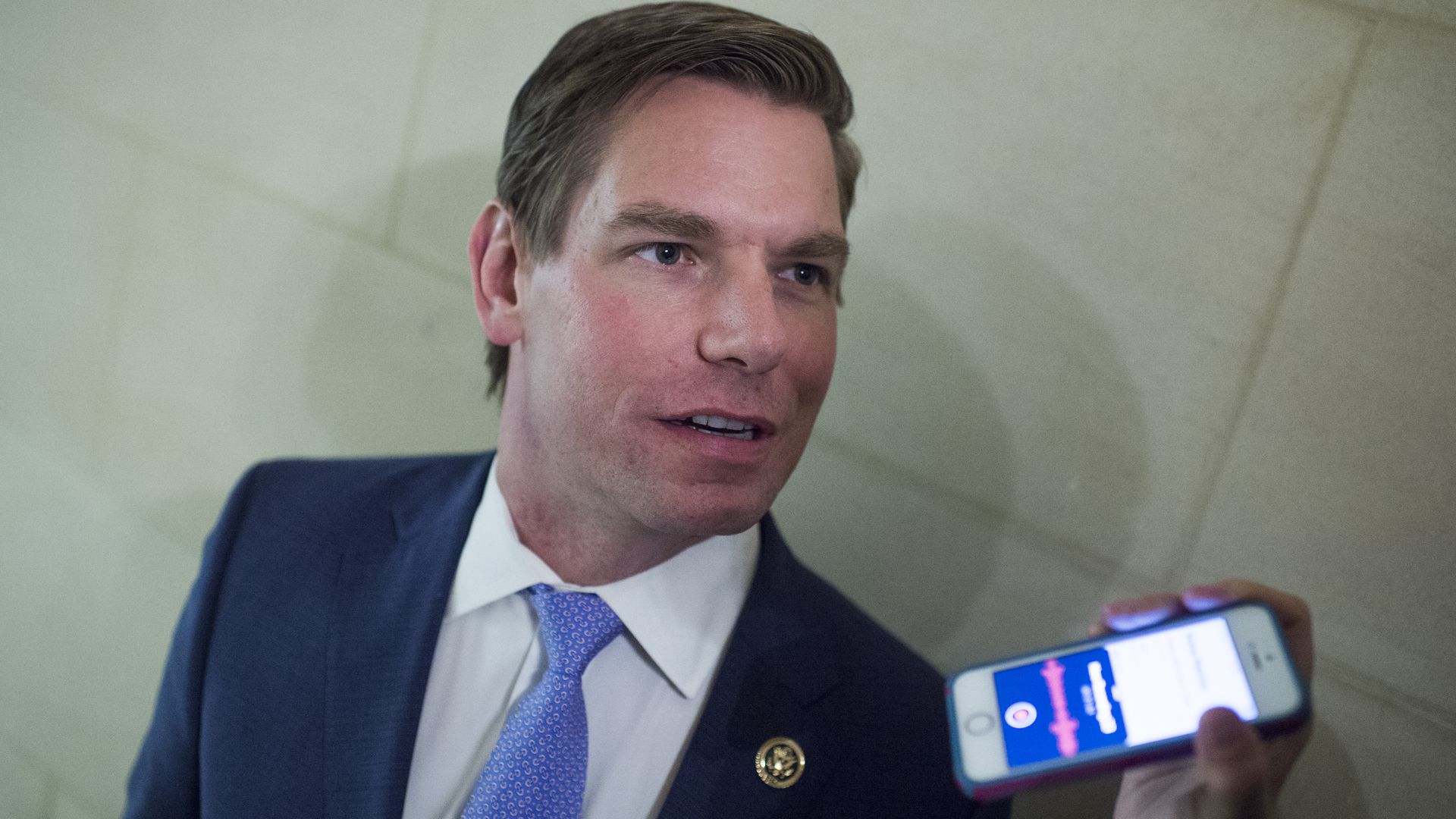 Eric Swalwell talks to a reporter