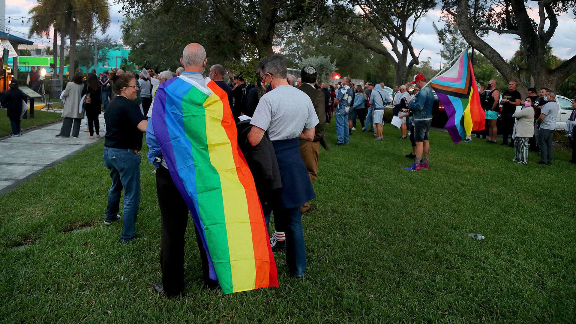 person wearing the LGBTQ flag